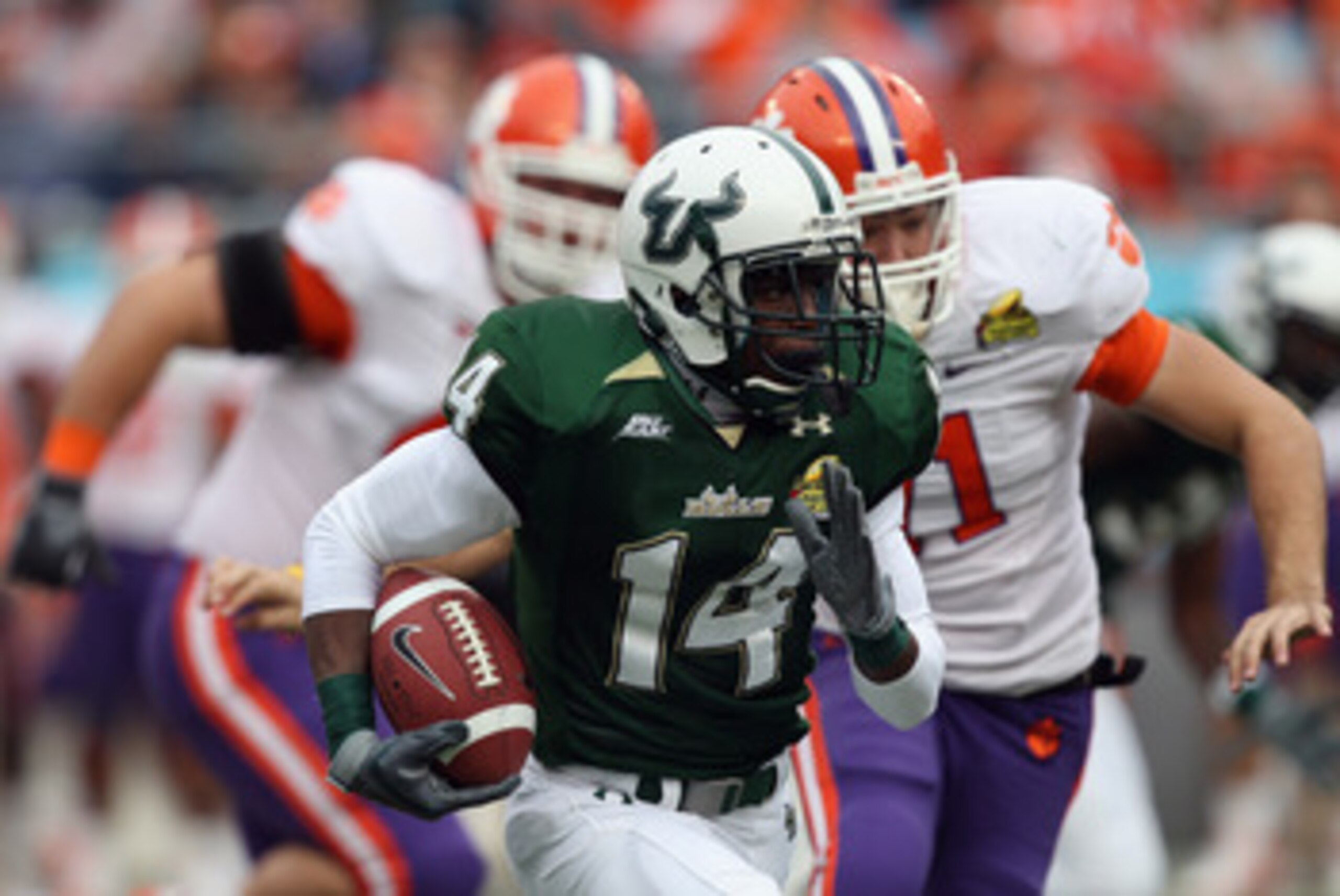 CHARLOTTE, NC - DECEMBER 31:  Terrence Mitchell #14 of the USF Bulls runs with the ball against the Clemson Tigers during their game at Bank of America Stadium on December 31, 2010 in Charlotte, North Carolina.  (Photo by Streeter Lecka/Getty Images)