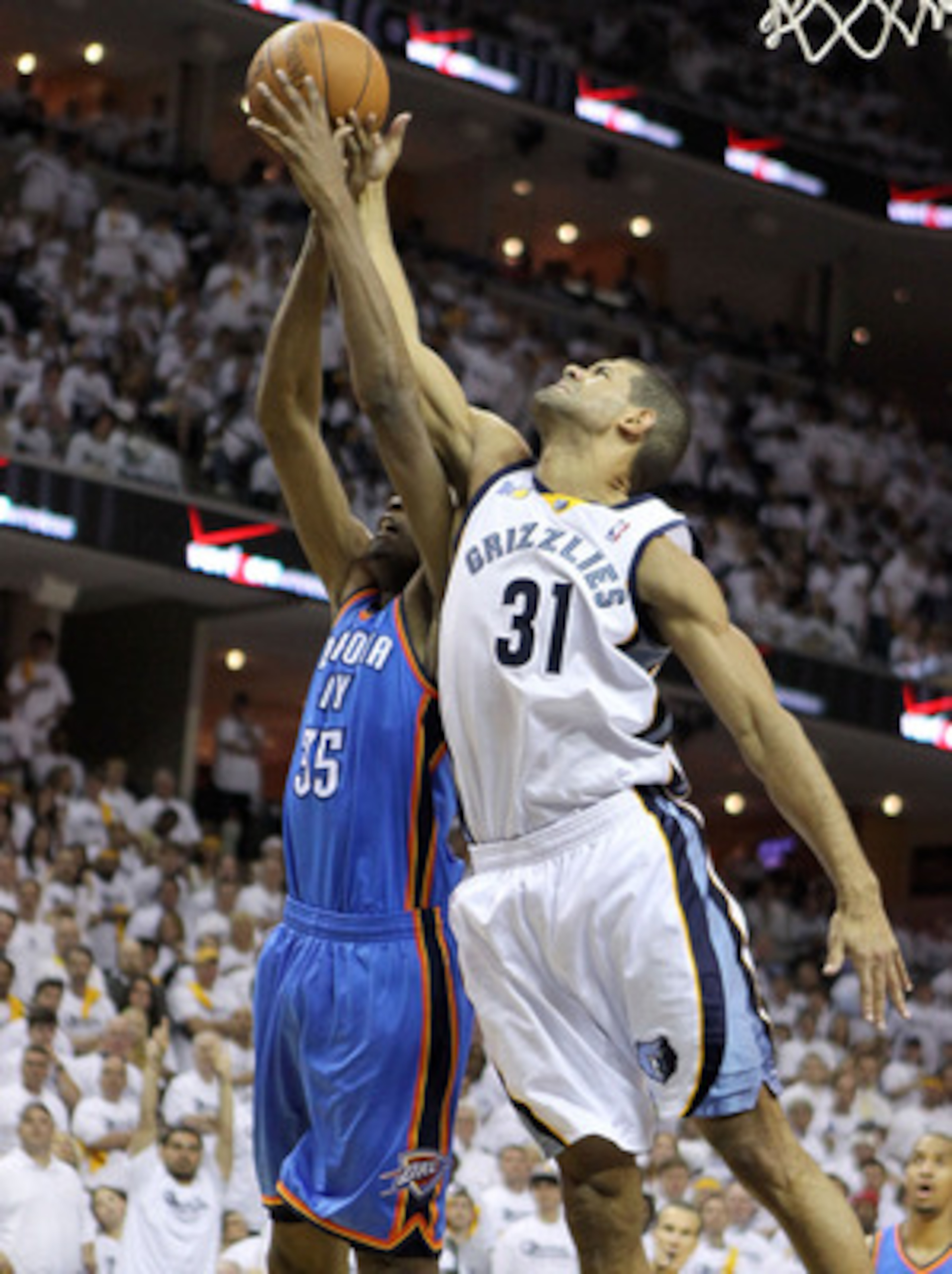 MEMPHIS, TN - MAY 07:  Kevin Durant #35 of the Oklahoma City Thunder and Shane Battier #31 of the Memphis Grizzlies reach for a rebound in Game Three of the Western Conference Semifinals in the 2011 NBA Playoffs at FedExForum on May 7, 2011 in Memphis, Te