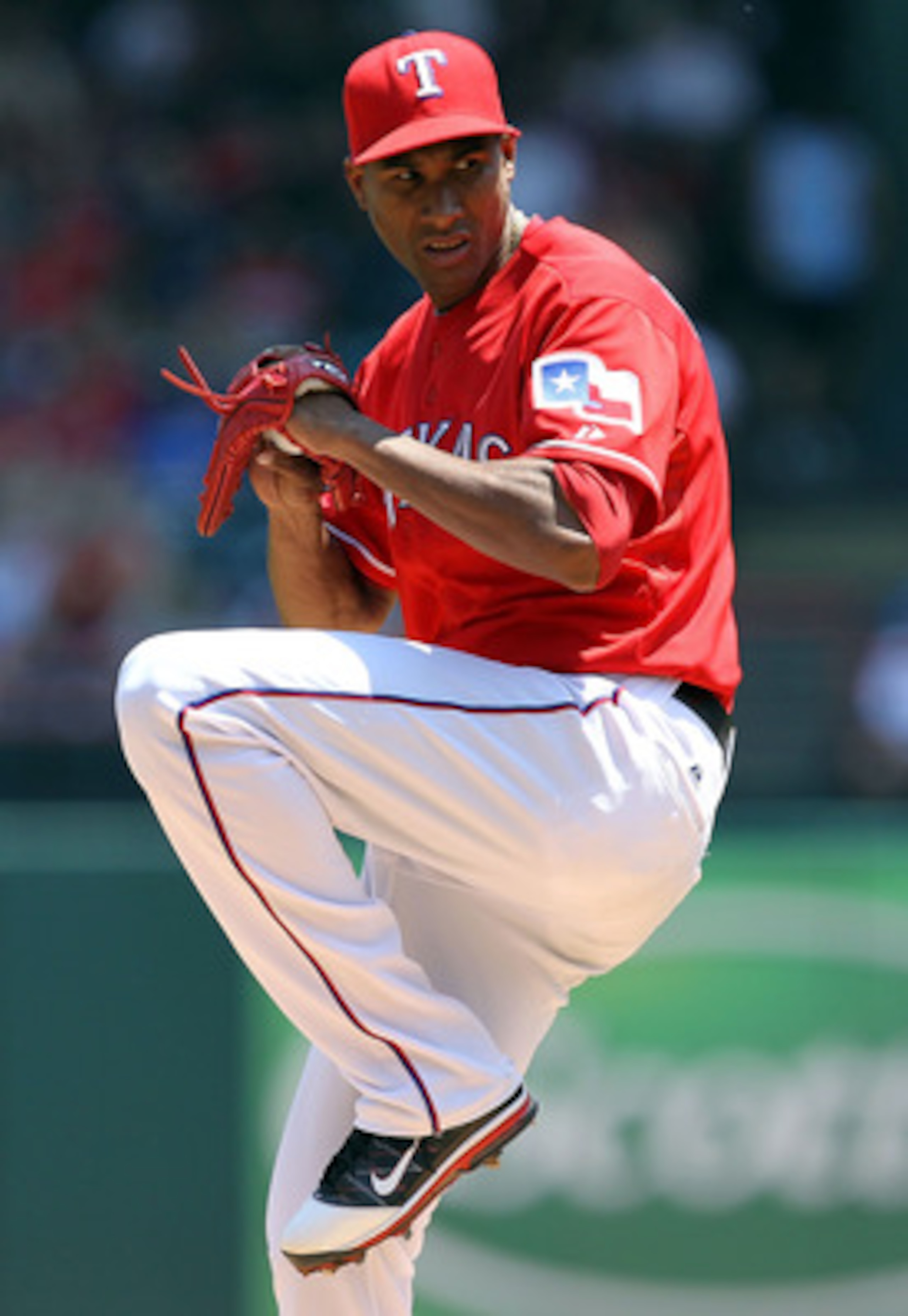 ARLINGTON, TX - MAY 29:  Alexi Ogando #41 of the Texas Rangers throws against the Kansas City Royals at Rangers Ballpark in Arlington on May 29, 2011 in Arlington, Texas.  (Photo by Ronald Martinez/Getty Images)