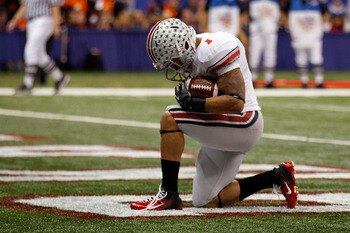 NEW ORLEANS, LA - JANUARY 04: Dan Herron #1 of the Ohio State Buckeyes reacts after he scores on a nine-yard touchdown run in the first half against the Arkansas Razorbacks during the Allstate Sugar Bowl at the Louisiana Superdome on January 4, 2011 in N NEW ORLEANS, LA - JANUARY 04: Dan Herron #1 of the Ohio State Buckeyes reacts after he scores on a nine-yard touchdown run in the first half against the Arkansas Razorbacks during the Allstate Sugar Bowl at the Louisiana Superdome on January 4, 2011 in N