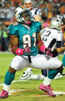 MIAMI - OCTOBER 4: Cameron Wake #91 of the Miami Dolphins celebrates after a play against the New England Patriots at Sun Life Field on October 4, 2010 in Miami, Florida. (Photo by Scott Cunningham/Getty Images)