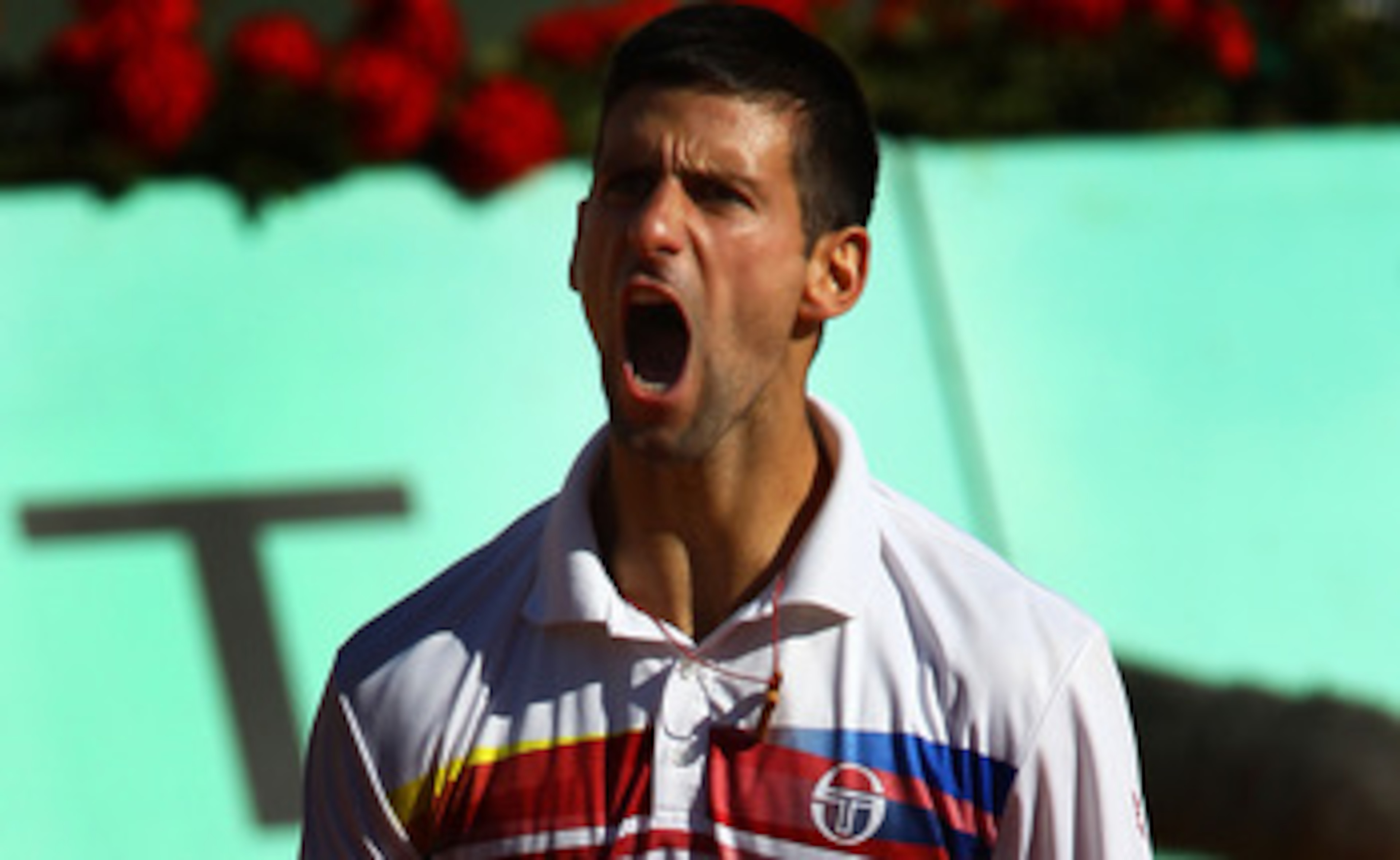 PARIS, FRANCE - MAY 29:  Novak Djokovic of Serbia celebrates matchpoint during the men's singles round four match between Richard Gasquet of France and Novak Djokovic of Serbia on day eight of the French Open at Roland Garros on May 29, 2011 in Paris, Fra
