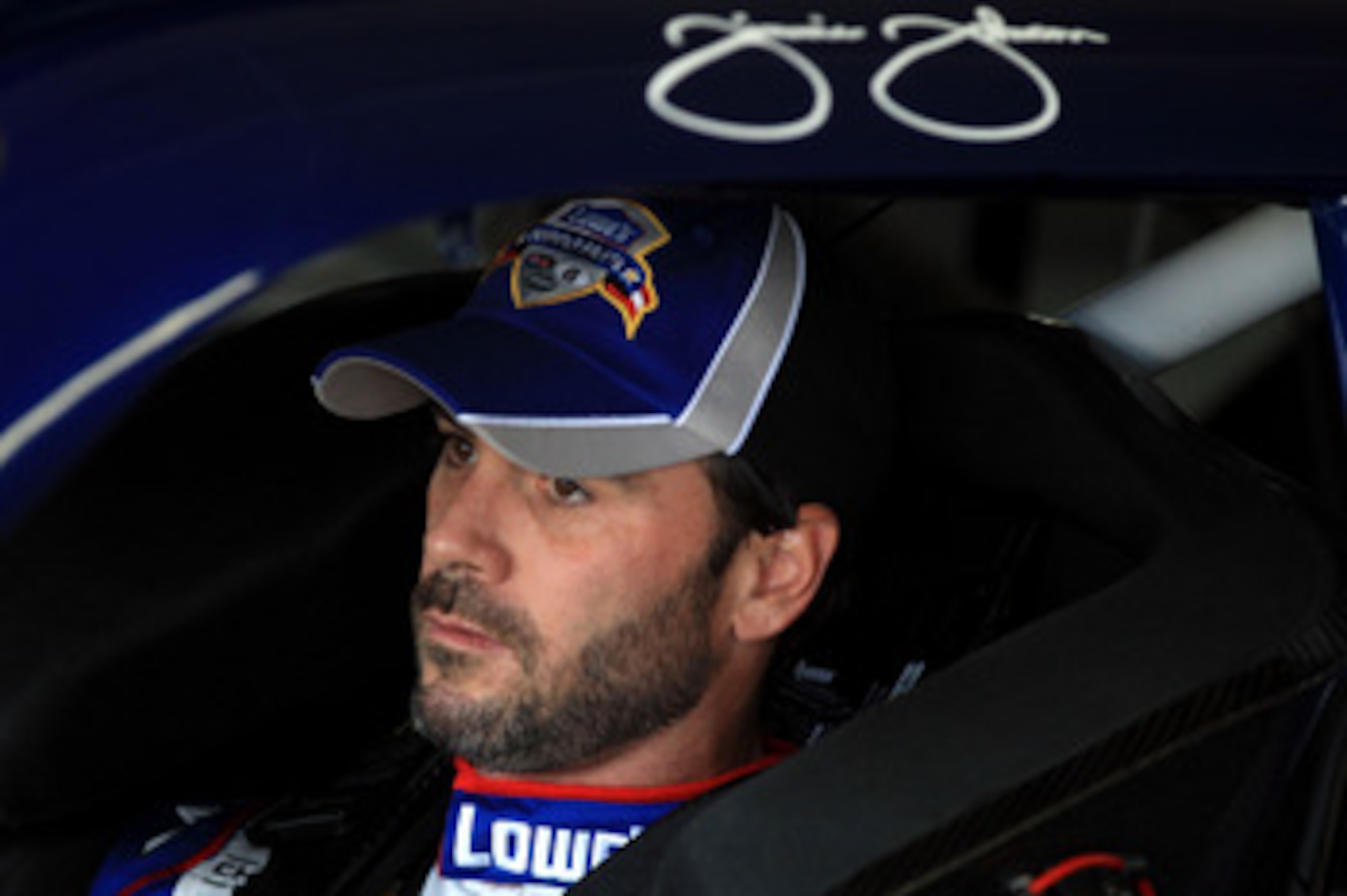 CHARLOTTE, NC - MAY 26:  Jimmie Johnson, driver of the #48 Lowe's Summer Salute Chevrolet, sits in his car during practice for the NASCAR Sprint Cup Series Coca-Cola 600 at Charlotte Motor Speedway on May 26, 2011 in Charlotte, North Carolina.  (Photo by