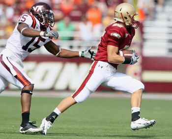 CHESTNUT HILL, MA - SEPTEMBER 25:  Eddie Whitley #15  of the Virginia Tech Hokies chases Bobby Swigert #86  of the Boston College Eagles on September 25, 2010 at Alumni Stadium in Chestnut Hill, Massachusetts.  (Photo by Elsa/Getty Images)