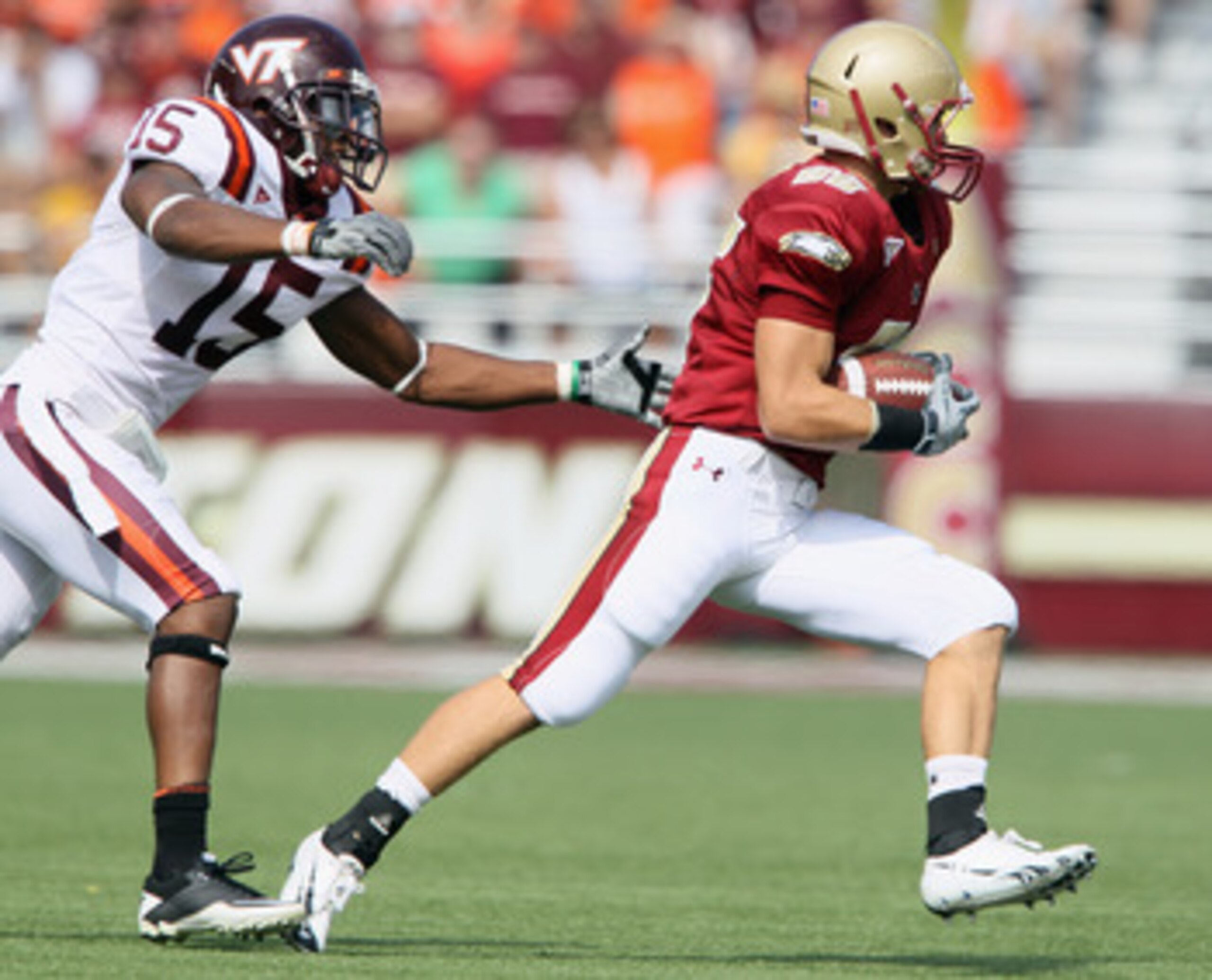 CHESTNUT HILL, MA - SEPTEMBER 25:  Eddie Whitley #15  of the Virginia Tech Hokies chases Bobby Swigert #86  of the Boston College Eagles on September 25, 2010 at Alumni Stadium in Chestnut Hill, Massachusetts.  (Photo by Elsa/Getty Images)