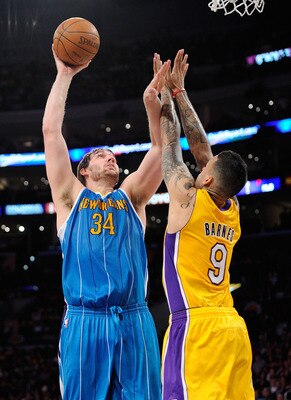 LOS ANGELES, CA - APRIL 20:  Aaron Gray #34 of the New Orleans Hornets shoots over Matt Barnes #9 of the Los Angeles Lakers in Game Two of the Western Conference Quarterfinals in the 2011 NBA Playoffs on April 20, 2011 at Staples Center in Los Angeles, Ca