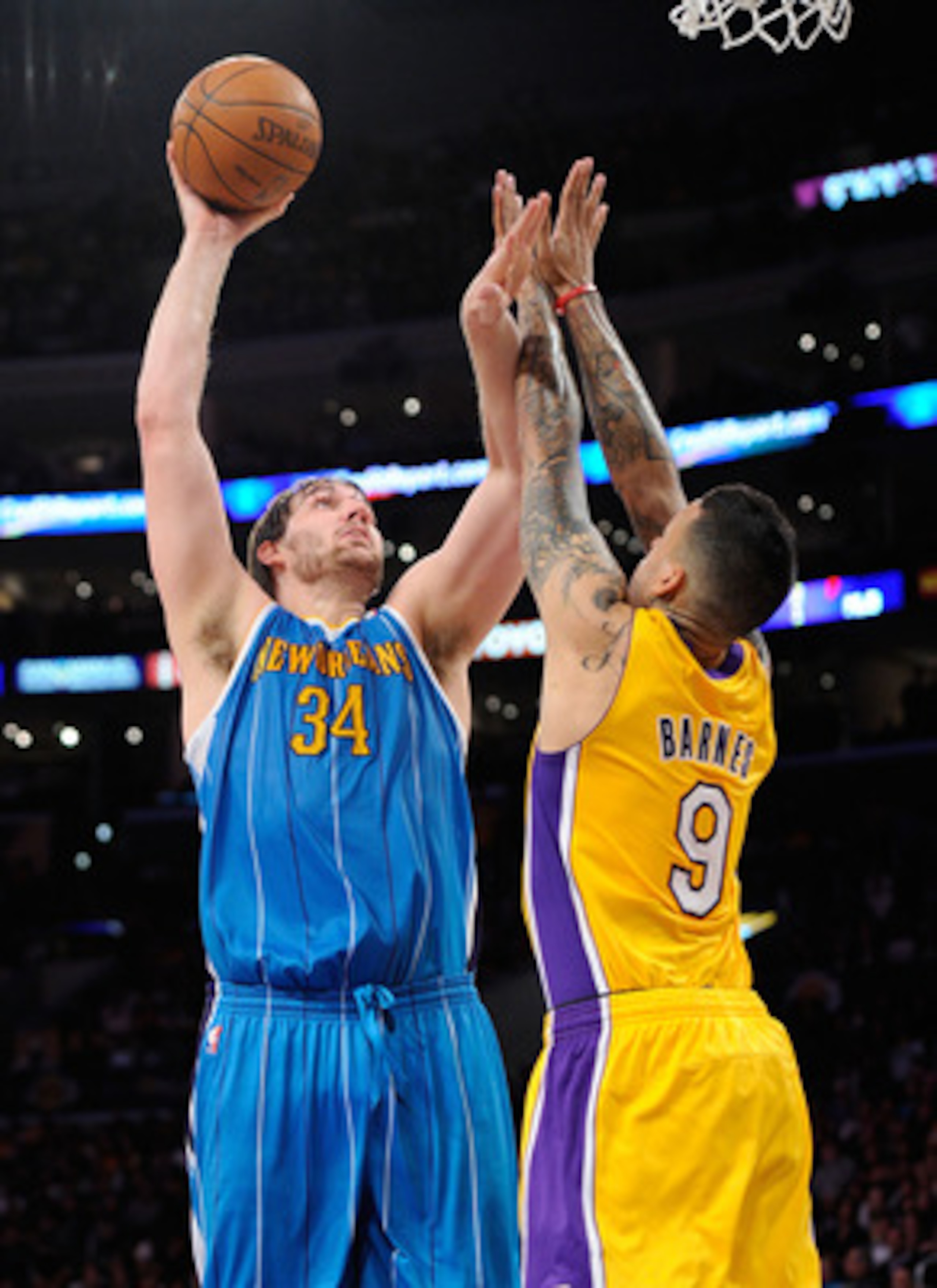 LOS ANGELES, CA - APRIL 20:  Aaron Gray #34 of the New Orleans Hornets shoots over Matt Barnes #9 of the Los Angeles Lakers in Game Two of the Western Conference Quarterfinals in the 2011 NBA Playoffs on April 20, 2011 at Staples Center in Los Angeles, Ca