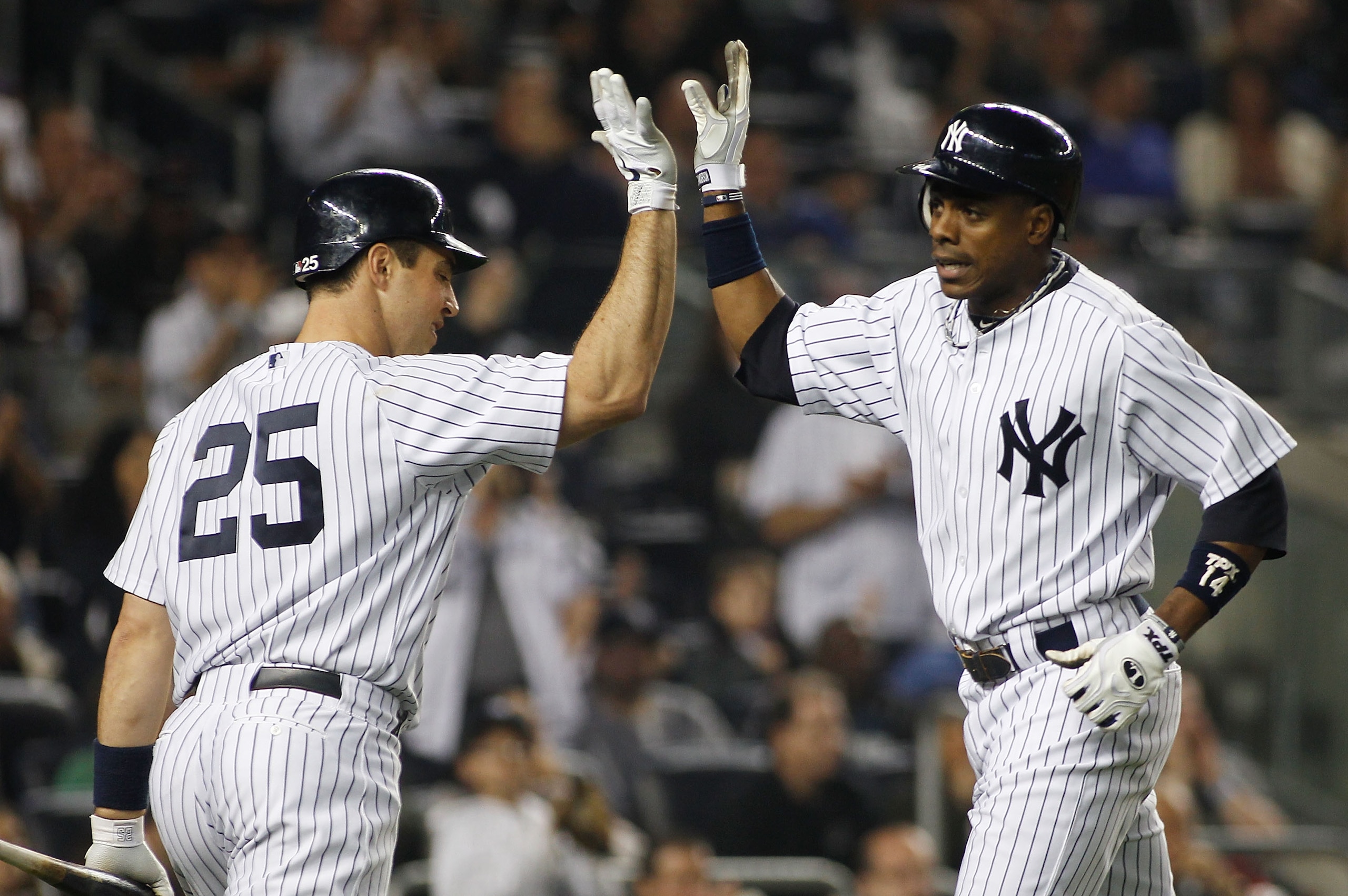 NEW YORK - MAY 21: Curtis Granderson #14 of the New York Yankees is congratulated by teammate Mark Teixeira #25 after hitting a two-run homerun in the bottom of the sixth inning against the New York Mets on May 21, 2011 at Yankee Stadium in the Bronx boro NEW YORK - MAY 21: Curtis Granderson #14 of the New York Yankees is congratulated by teammate Mark Teixeira #25 after hitting a two-run homerun in the bottom of the sixth inning against the New York Mets on May 21, 2011 at Yankee Stadium in the Bronx boro