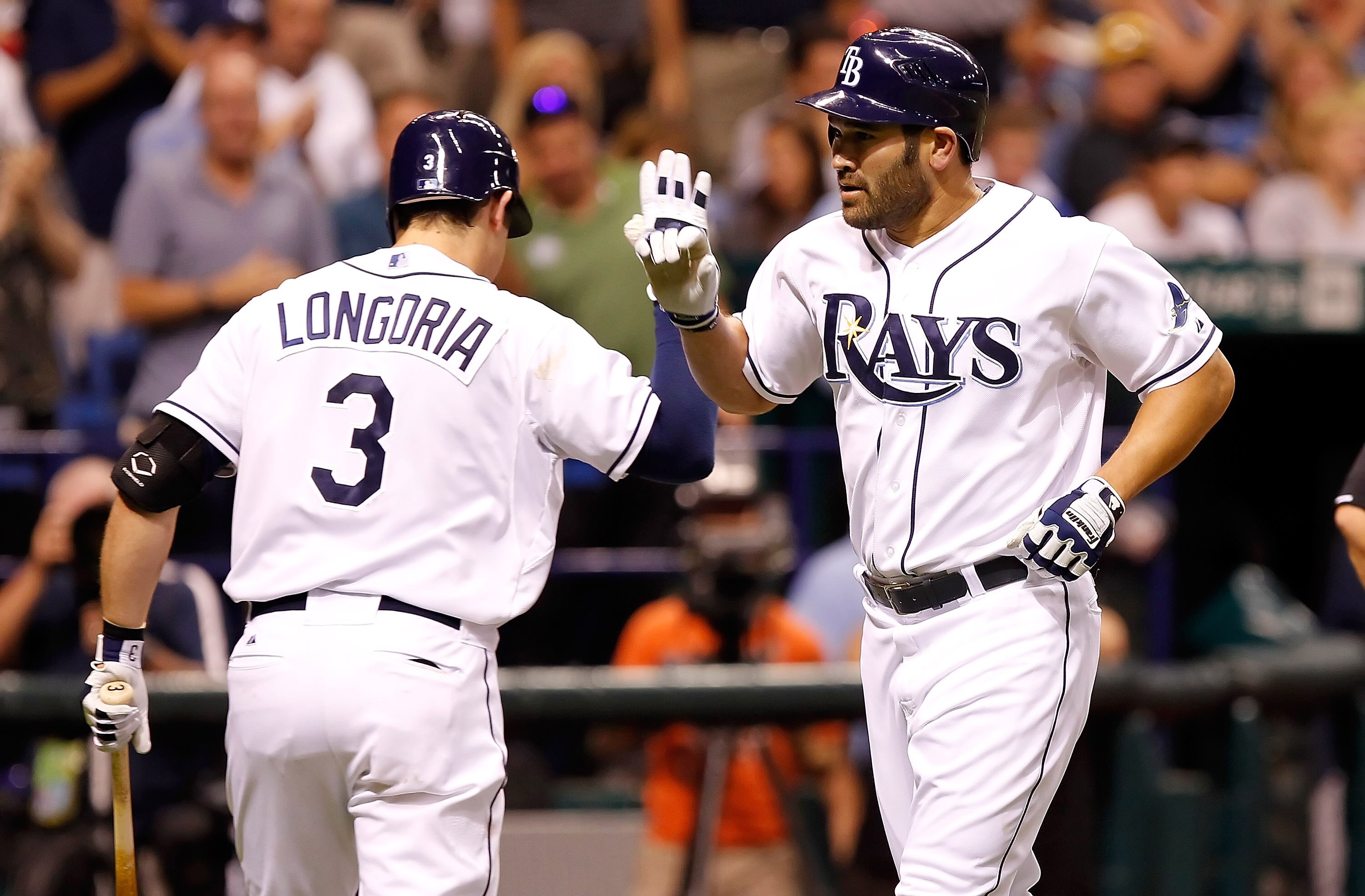 ST. PETERSBURG, FL - MAY 16:  Designated hitter Johnny Damon #22 of the Tampa Bay Rays is congratulated by Evan Longoria #3 after his home run against the New York Yankees during the game at Tropicana Field on May 16, 2011 in St. Petersburg, Florida.  (Ph