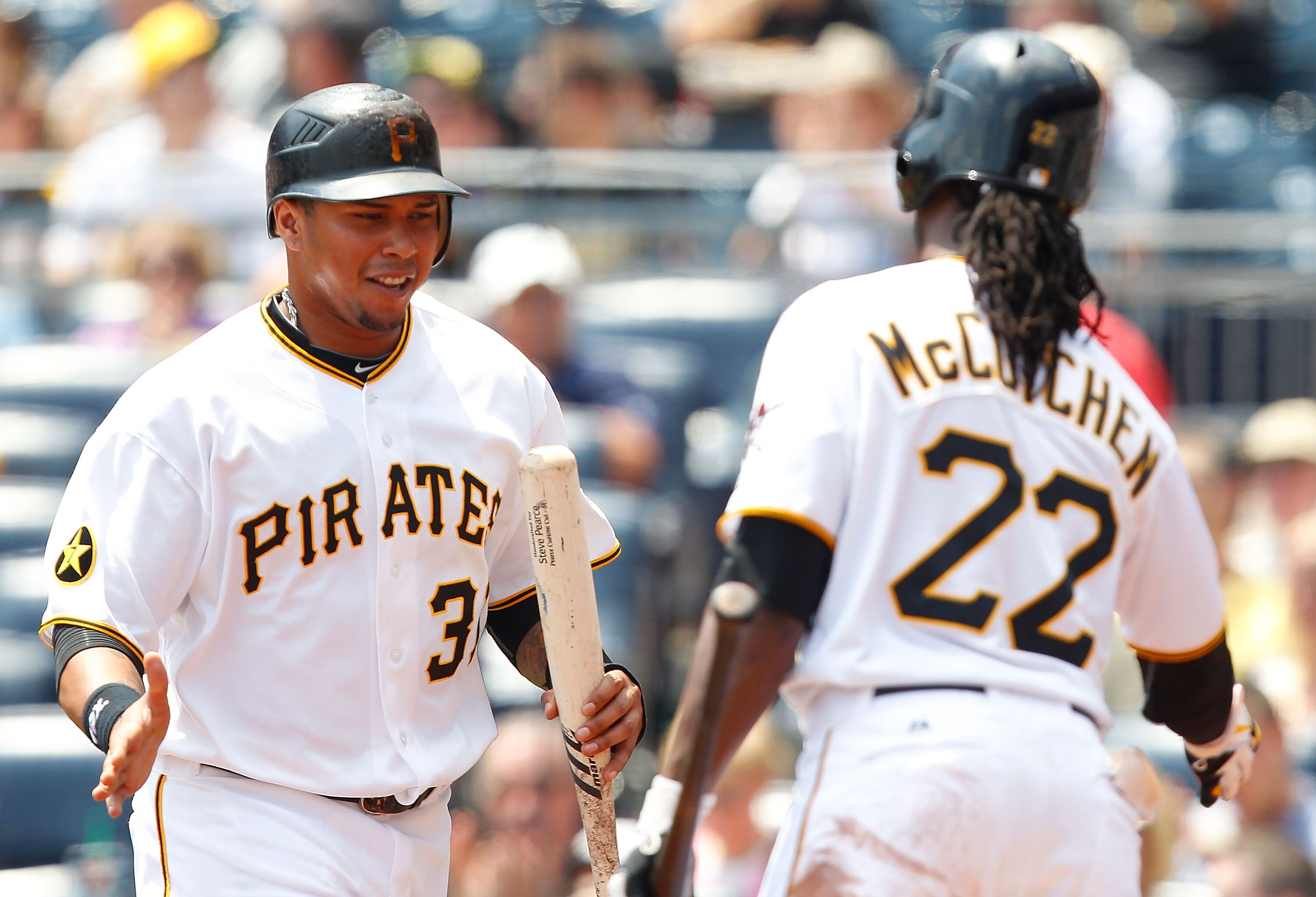 PITTSBURGH - MAY 25:  Jose Tabata #31 of the Pittsburgh Pirates celebrates with teammate Andrew McCutchen #22 after scoring against the Atlanta Braves during the game on May 25, 2011 at PNC Park in Pittsburgh, Pennsylvania.  (Photo by Jared Wickerham/Gett