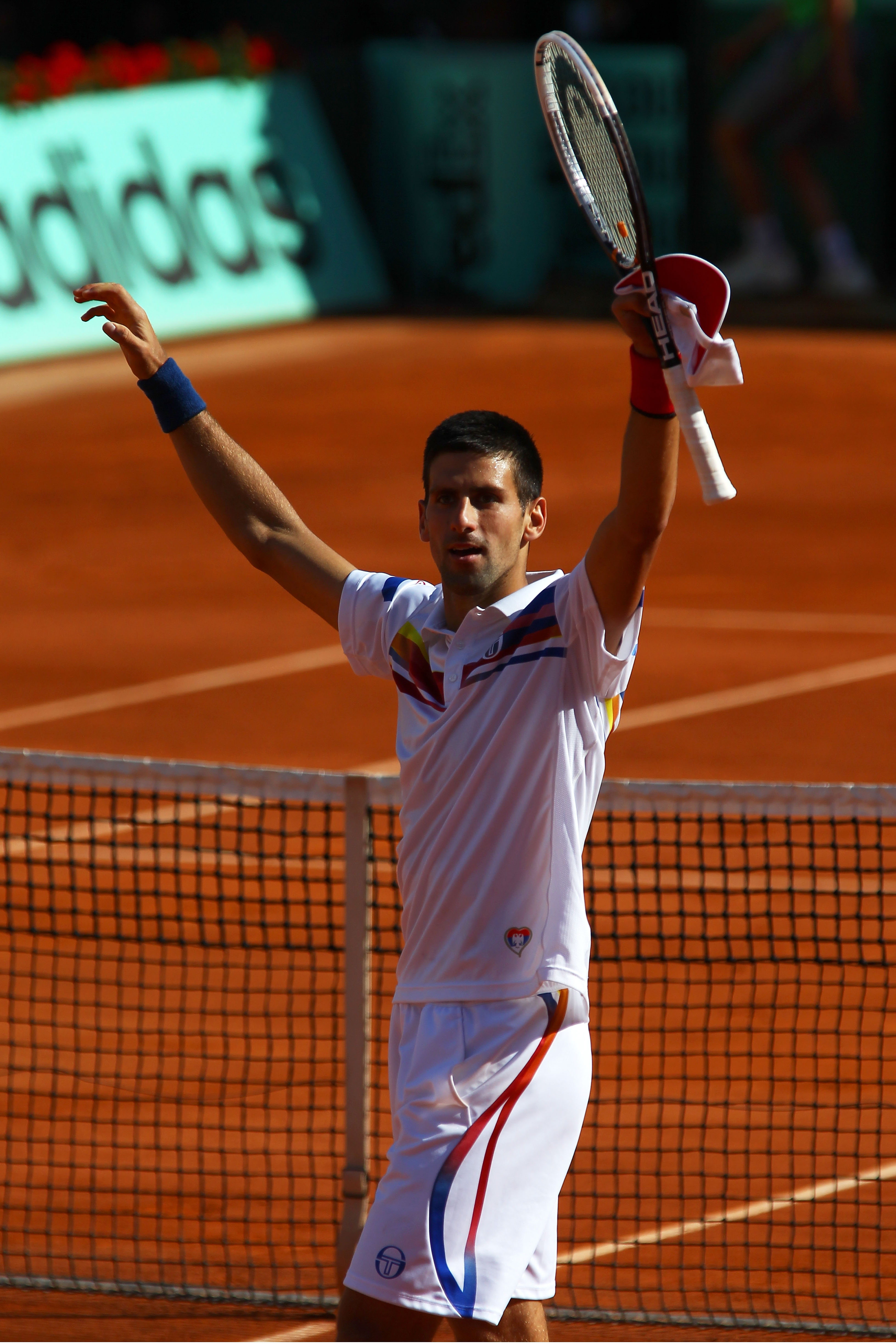 PARIS, FRANCE - MAY 29:  Novak Djokovic of Serbia celebrates matchpoint during the men's singles round four match between Richard Gasquet of France and Novak Djokovic of Serbia on day eight of the French Open at Roland Garros on May 29, 2011 in Paris, Fra