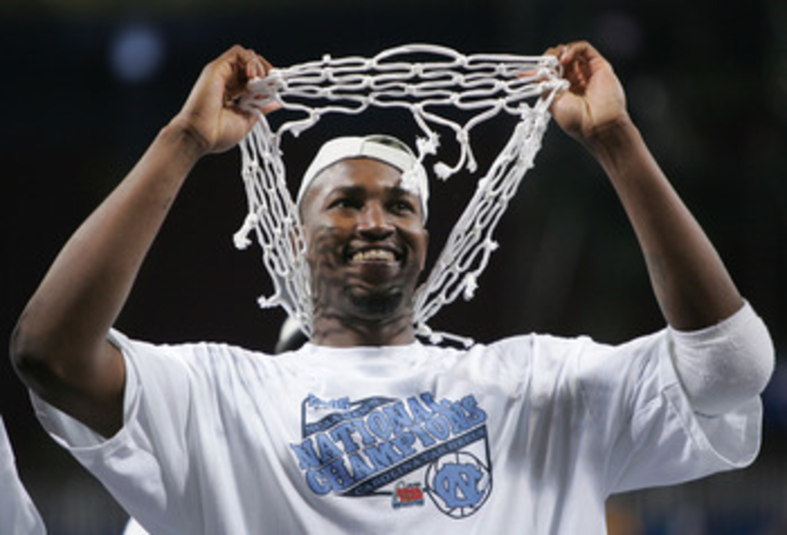 ST. LOUIS - APRIL 04:  Jawad Williams #21 of the North Carolina Tar Heels celebrates with one of the nets after defeating the Illinois Fighting Illini 75-70 during the NCAA Men's National Championship game at the Edward Jones Dome on April 4, 2005 in St.
