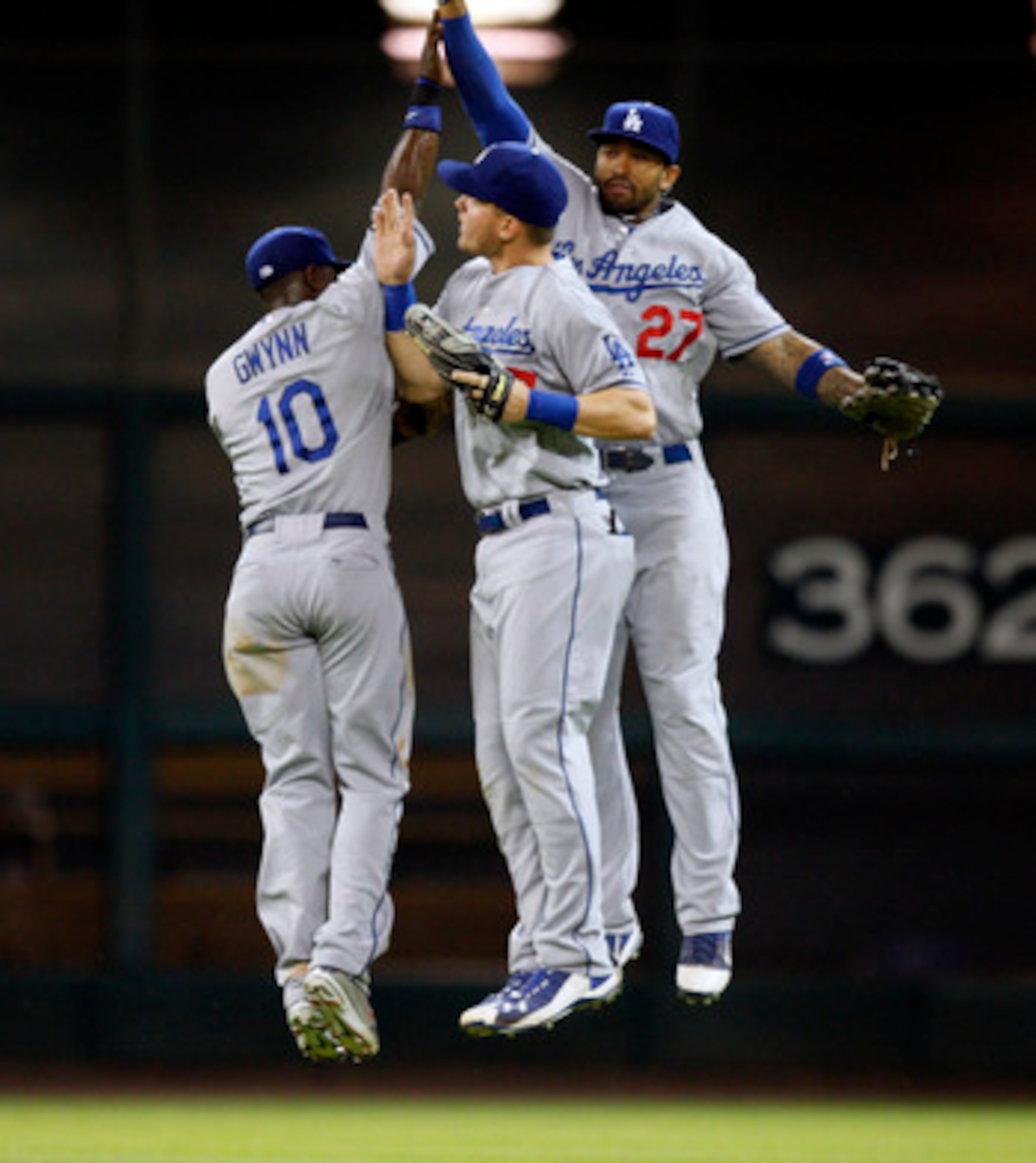 HOUSTON - MAY 24:  Tony Gwynn, Jr. #10, Jerry Sands #47 and Matt Kemp #27 of the Los Angeles Dodgers celebrate their win over the Houston Astros 5-4 at Minute Maid Park on May 24, 2011 in Houston, Texas.  (Photo by Bob Levey/Getty Images)