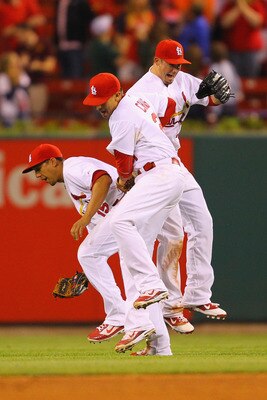 ST. LOUIS, MO - MAY 18: Jon Jay #15, Allen Craig #21 and Tyler Greene #27 all of the St.Louis Cardinals celebrate a victory over the Houston Astros at Busch Stadium on May 18, 2011 in St. Louis, Missouri.  (Photo by Dilip Vishwanat/Getty Images)