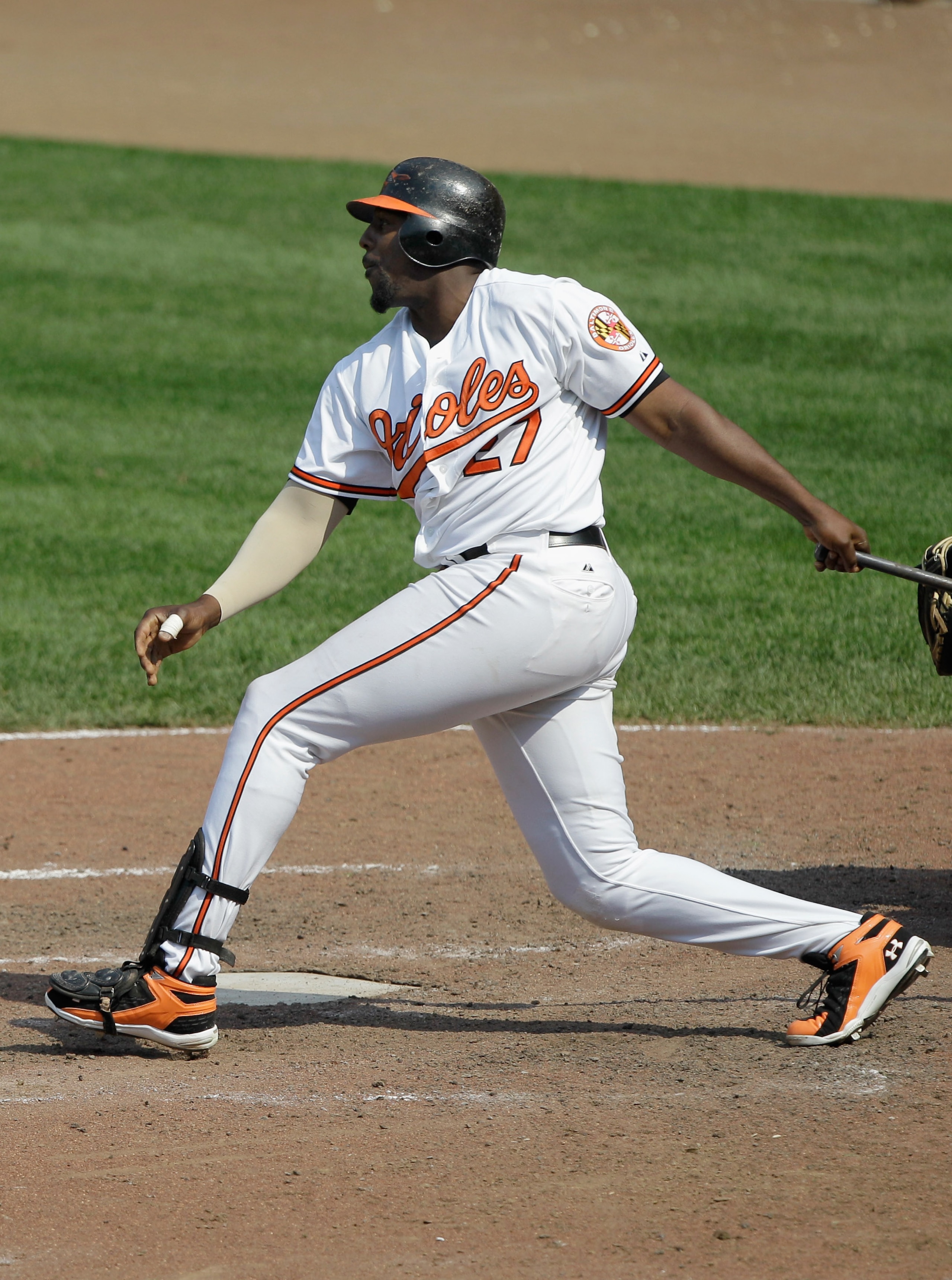 BALTIMORE, MD - MAY 26: Vladimir Guerrero #27 of the Baltimore Orioles follows his game winning RBI single to defeat the Kansas City Royals 6-5 in twelve innings at Oriole Park at Camden Yards on May 26, 2011 in Baltimore, Maryland.  (Photo by Rob Carr/Ge