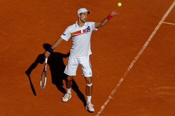 PARIS, FRANCE - MAY 29:  Novak Djokovic of Serbia serves during the men's singles round four match between Richard Gasquet of France and Novak Djokovic of Serbia on day eight of the French Open at Roland Garros on May 29, 2011 in Paris, France.  (Photo by