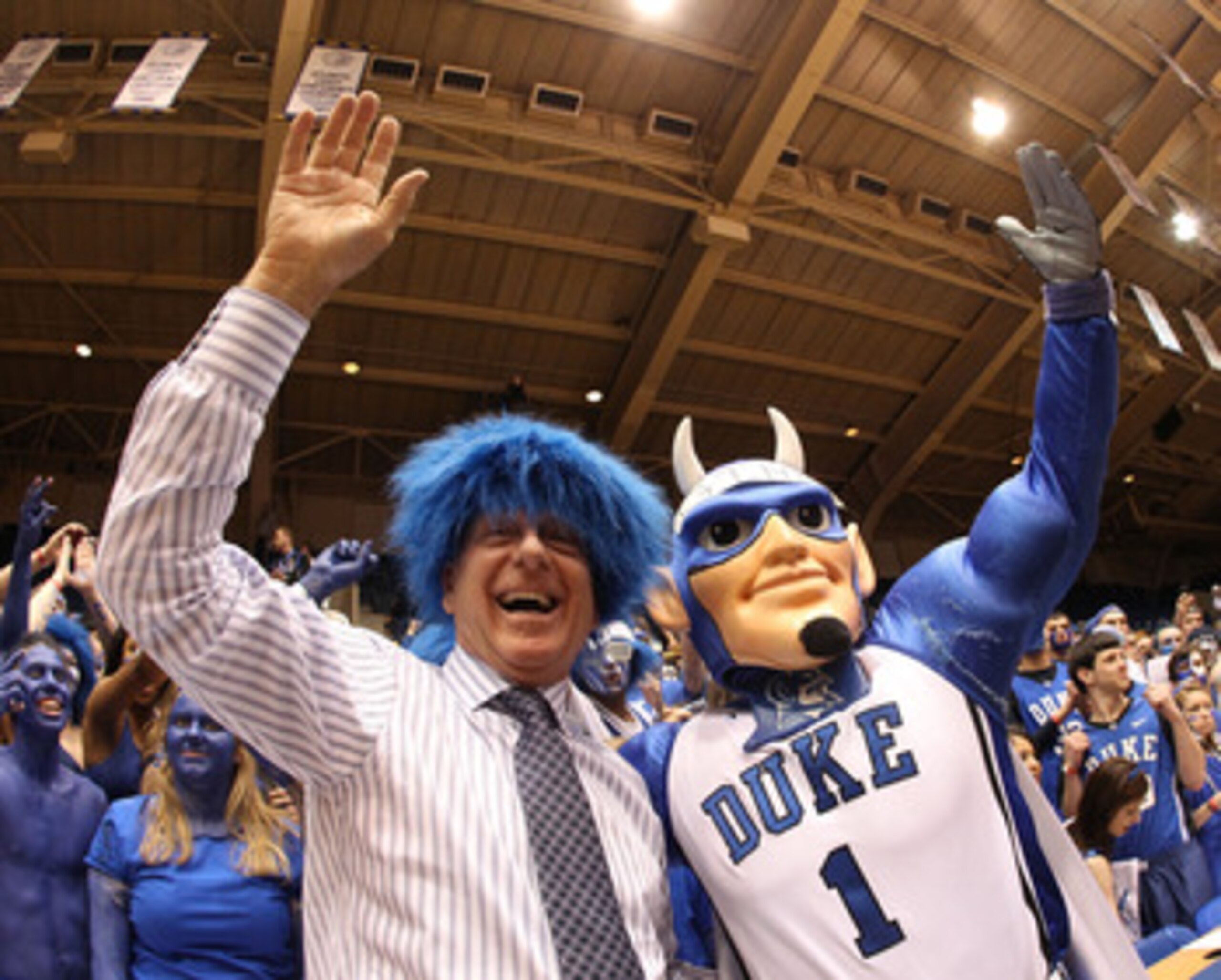 DURHAM, NC - MARCH 06:  ESPN analyst Dick Vitale celebrates with the Cameron Crazies before the start of the game between the North Carolina Tar Heels and Duke Blue Devils at Cameron Indoor Stadium on March 6, 2010 in Durham, North Carolina.  (Photo by St