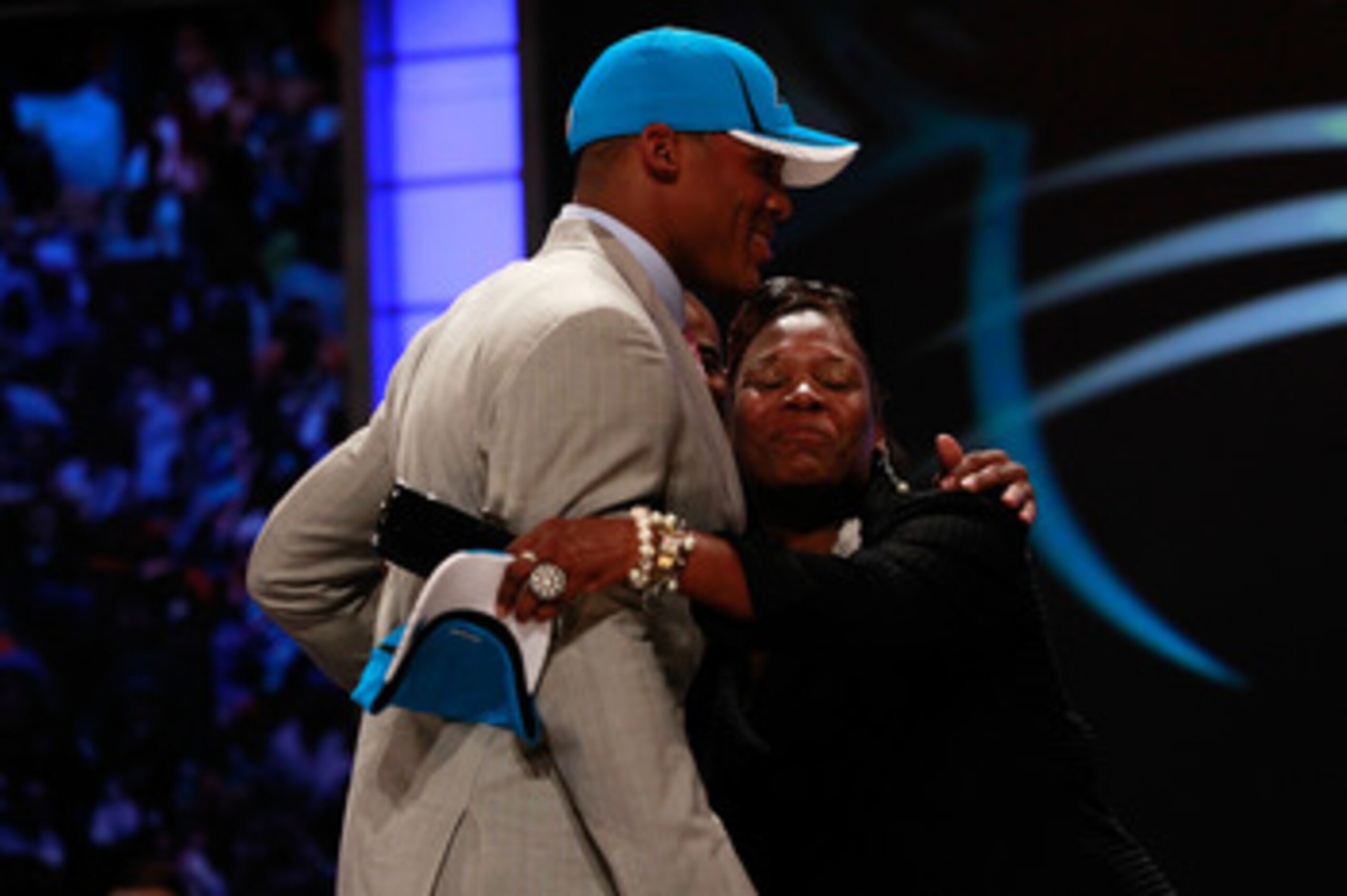 NEW YORK, NY - APRIL 28:  Cam Newton receives a hug from his mother Jackie on stage after he was selected #1 overall by the Carolina Panthers during the 2011 NFL Draft at Radio City Music Hall on April 28, 2011 in New York City.  (Photo by Chris Trotman/G