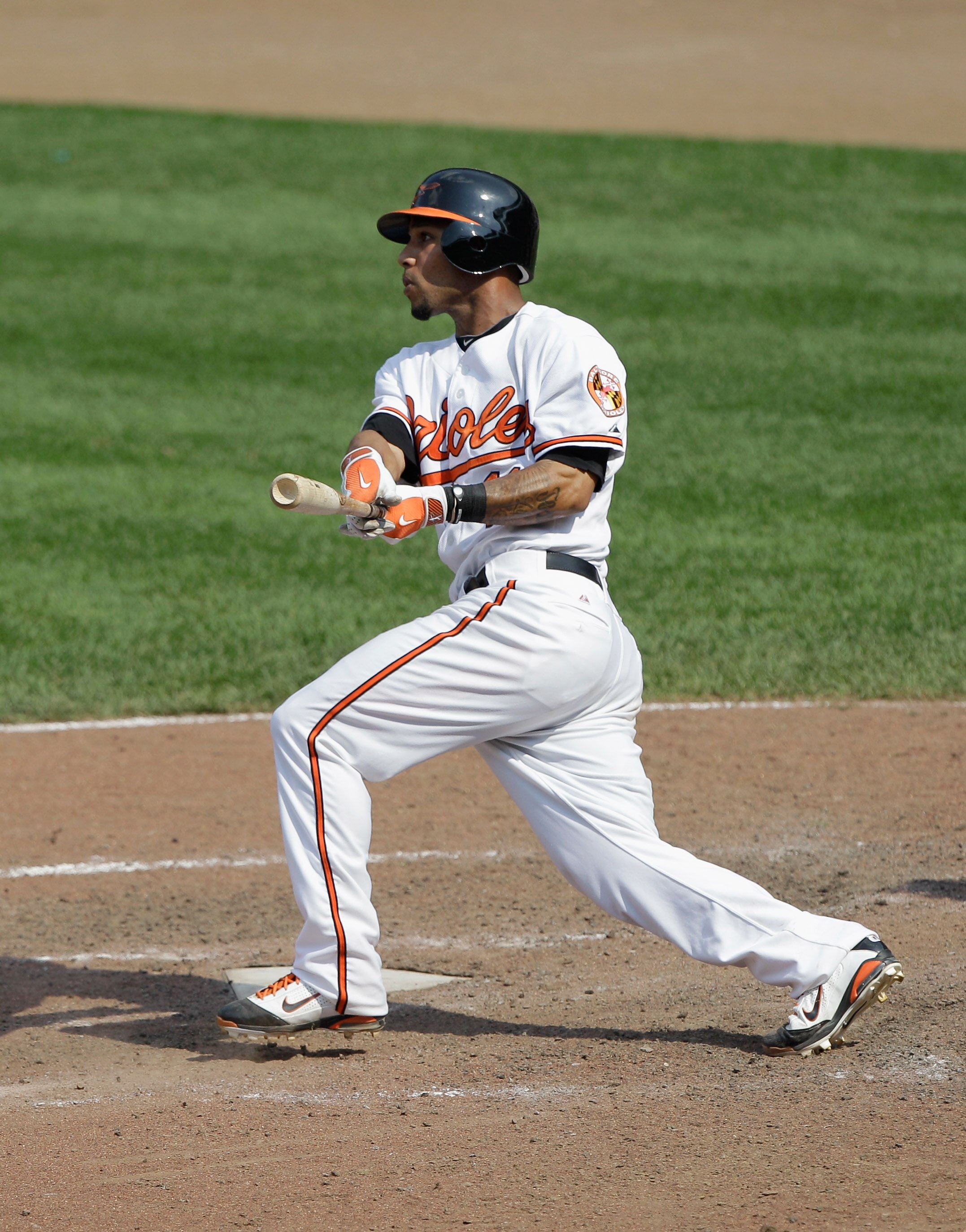 BALTIMORE, MD - MAY 26: Robert Andino #11 of the Baltimore Orioles at the plate against the Kansas City Royals at Oriole Park at Camden Yards on May 26, 2011 in Baltimore, Maryland.  (Photo by Rob Carr/Getty Images)