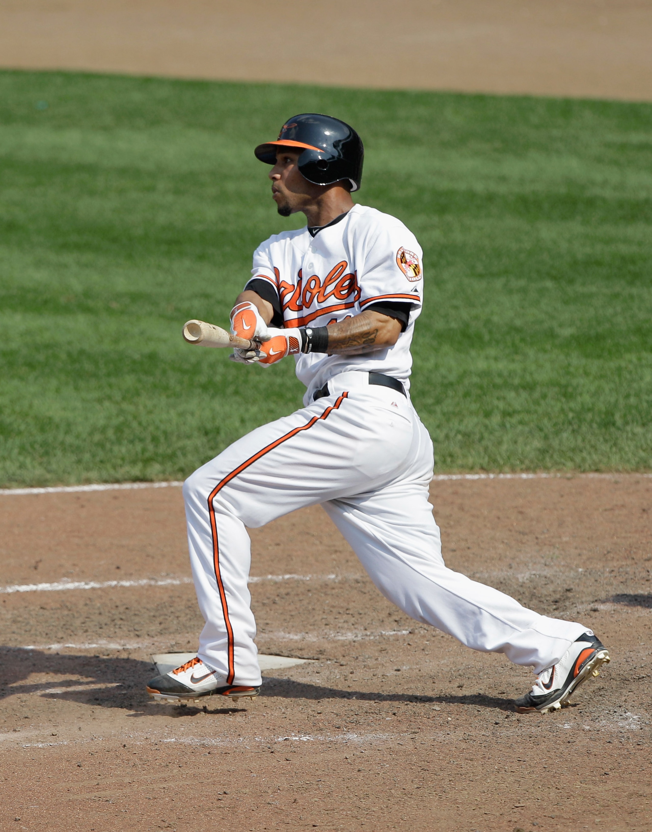 BALTIMORE, MD - MAY 26: Robert Andino #11 of the Baltimore Orioles at the plate against the Kansas City Royals at Oriole Park at Camden Yards on May 26, 2011 in Baltimore, Maryland.  (Photo by Rob Carr/Getty Images)