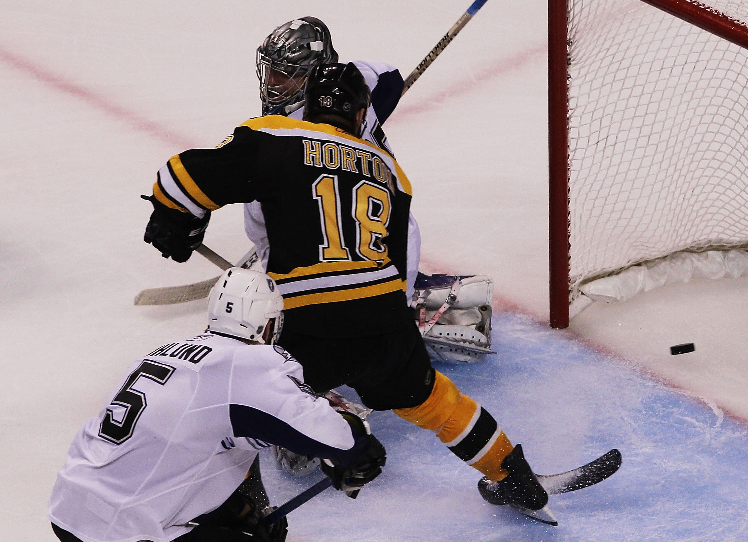 BOSTON, MA - MAY 27:  Nathan Horton #18 of the Boston Bruins scores a third period goal past Dwayne Roloson #35 of the Tampa Bay Lightning in Game Seven of the Eastern Conference Finals during the 2011 NHL Stanley Cup Playoffs at TD Garden on May 27, 2011