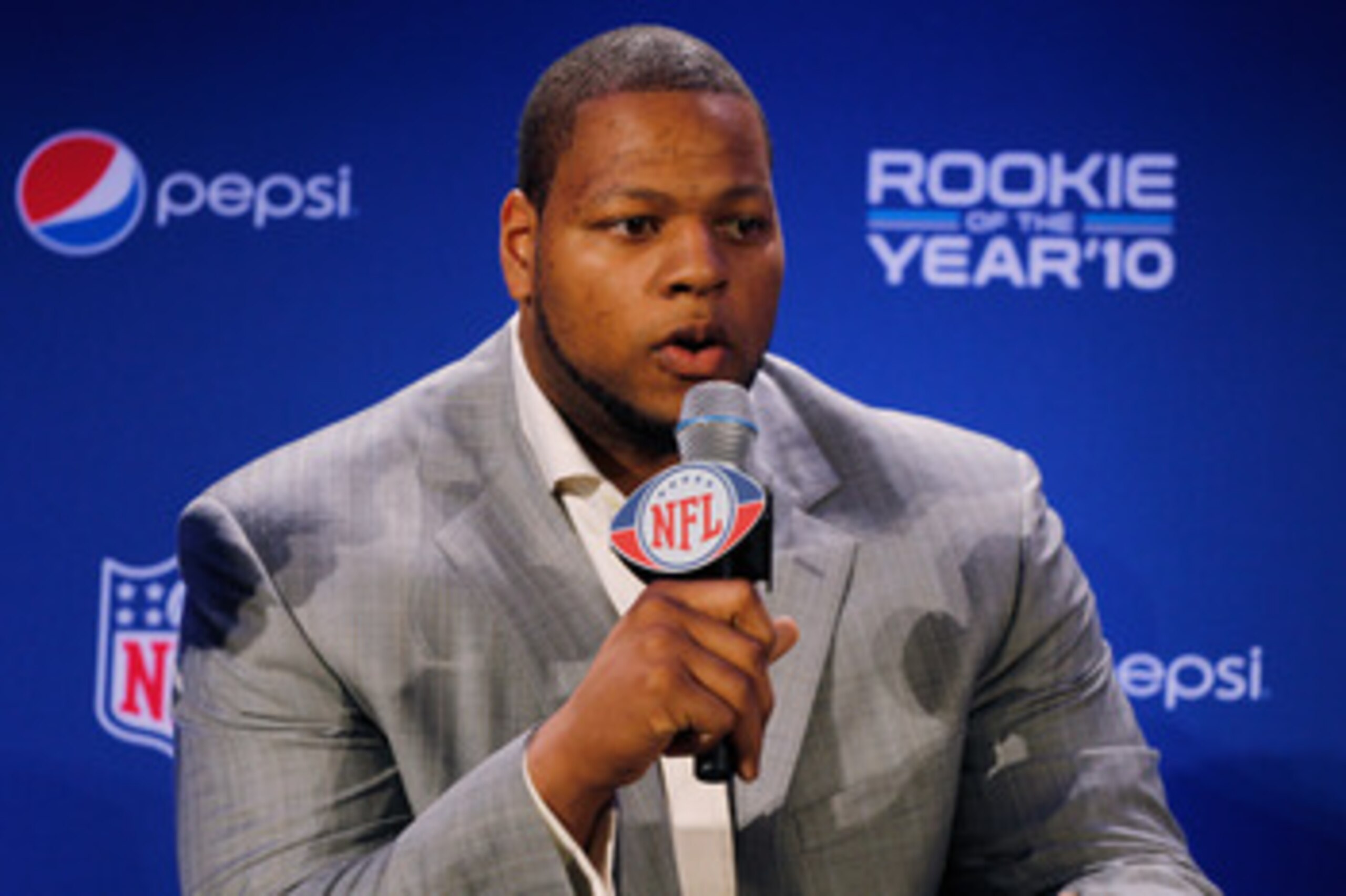 DALLAS, TX - FEBRUARY 03:  Ndamukong Suh #90 of the Detroit Lions speaks during a press conference where he accepted Pepsi's 2010 NFL Rookie of the Year Award at the Super Bowl XLV media center on February 3, 2011 in Dallas, Texas. The Green Bay Packers w