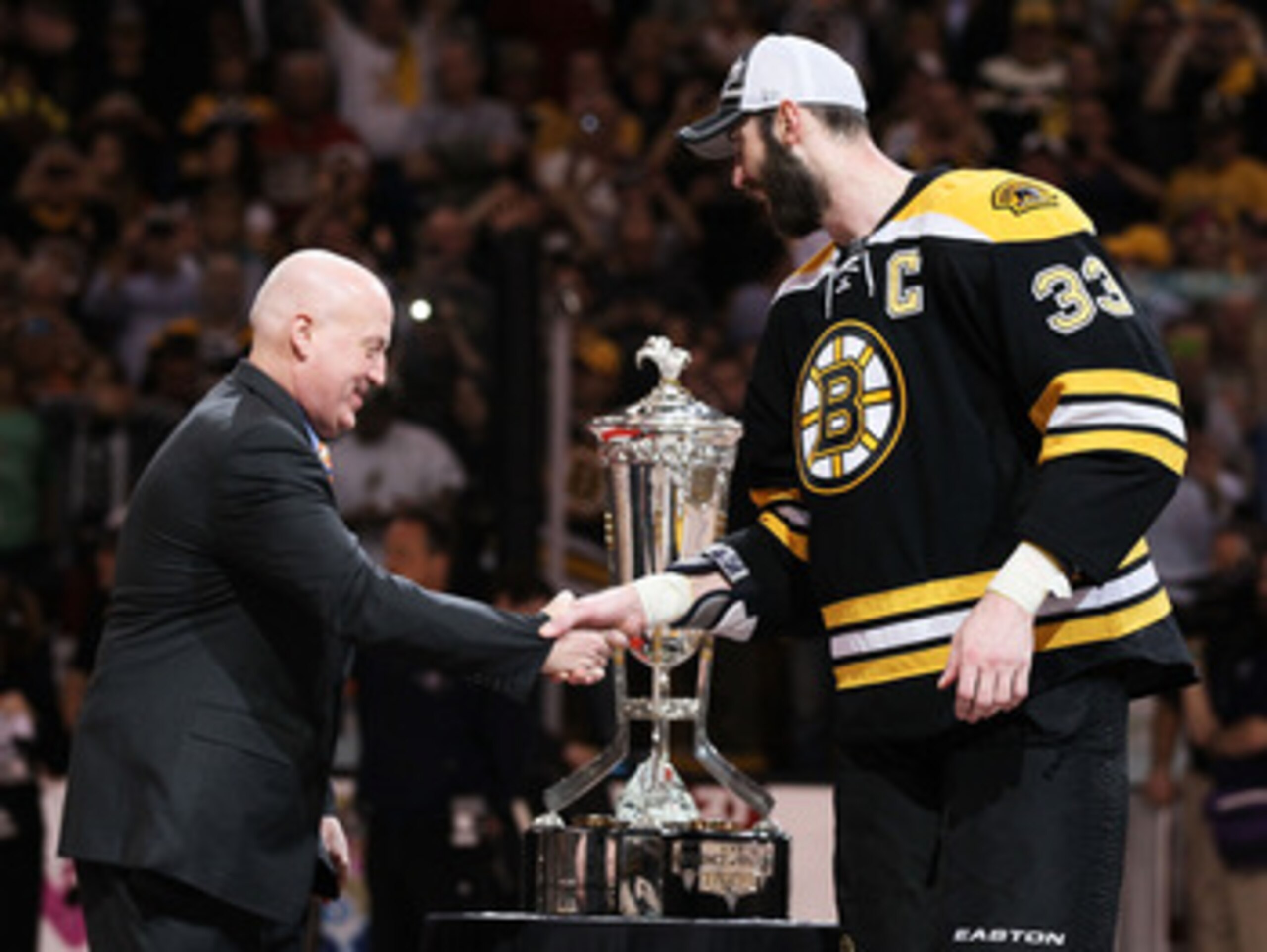 BOSTON, MA - MAY 27:  Deputy Commissioner Bill Daly shakes the hand of Zdeno Chara #33 of the Boston Bruins as he presents the The Prince of Wales trophy after they defeated the Tampa Bay Lightning 1 to 0 in Game Seven of the Eastern Conference Finals dur