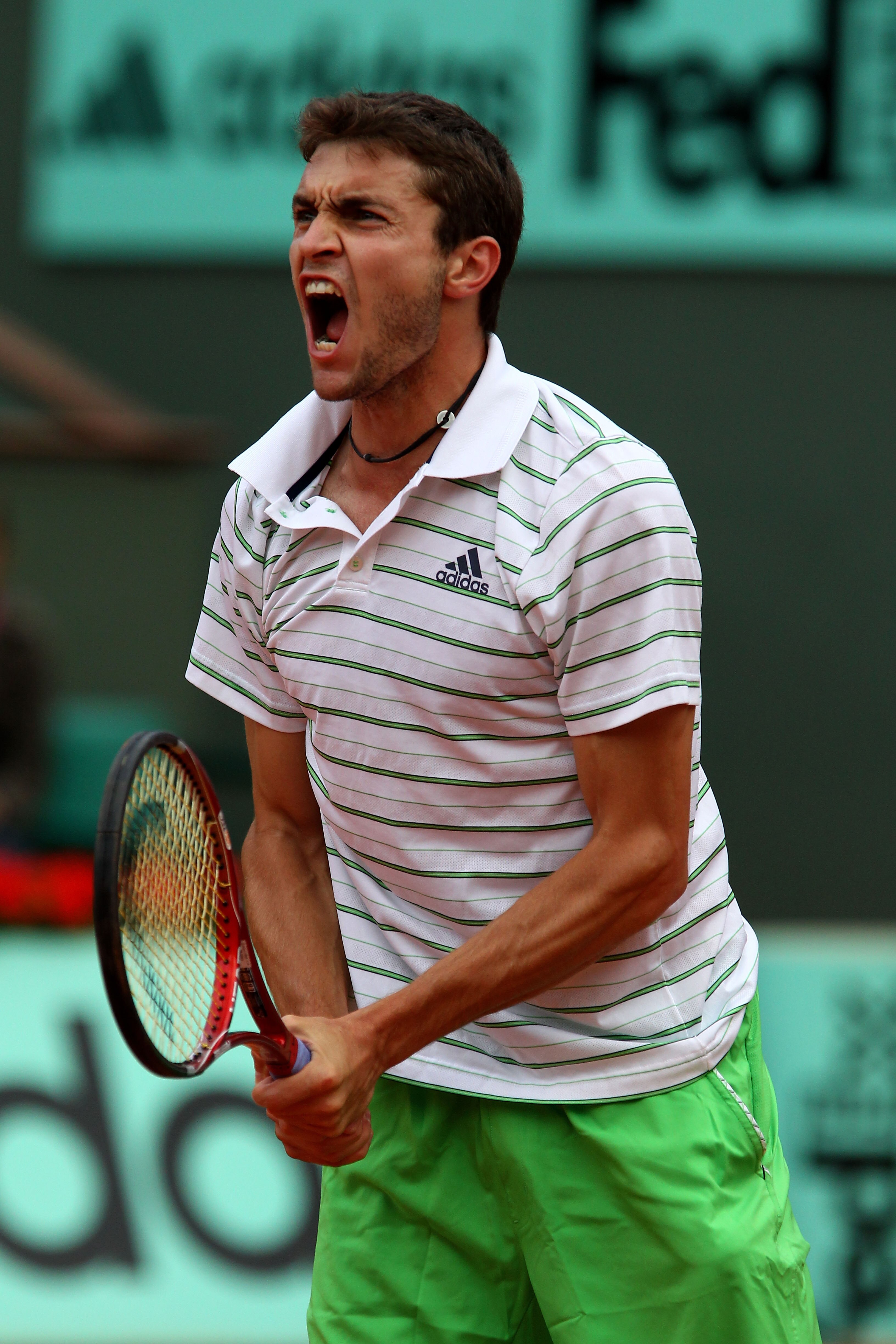 PARIS, FRANCE - MAY 26:  Gilles Simon of France celebrates a point during the men's singles round two match between Jeremy Chardy of France and Gilles Simon of France on day five of the French Open at Roland Garros on May 26, 2011 in Paris, France.  (Phot