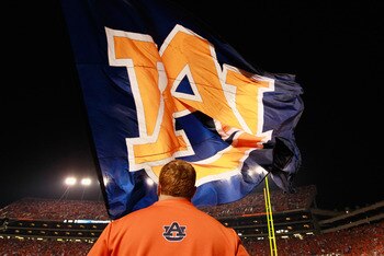 AUBURN, AL - NOVEMBER 13:  Cheerleaders of the Auburn Tigers wave one of their giant flags against the Georgia Bulldogs at Jordan-Hare Stadium on November 13, 2010 in Auburn, Alabama.  (Photo by Kevin C. Cox/Getty Images)
