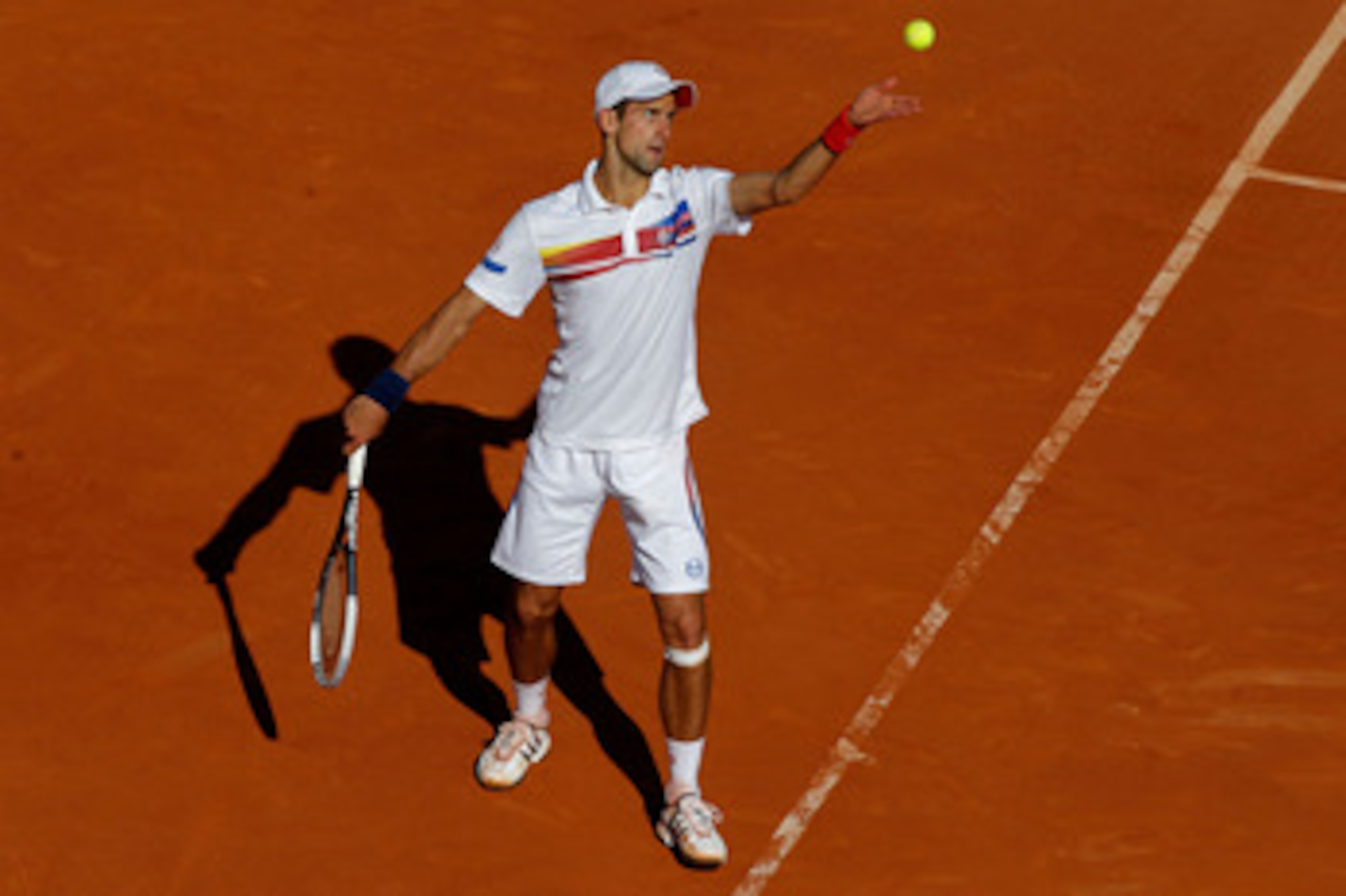 PARIS, FRANCE - MAY 29:  Novak Djokovic of Serbia serves during the men's singles round four match between Richard Gasquet of France and Novak Djokovic of Serbia on day eight of the French Open at Roland Garros on May 29, 2011 in Paris, France.  (Photo by