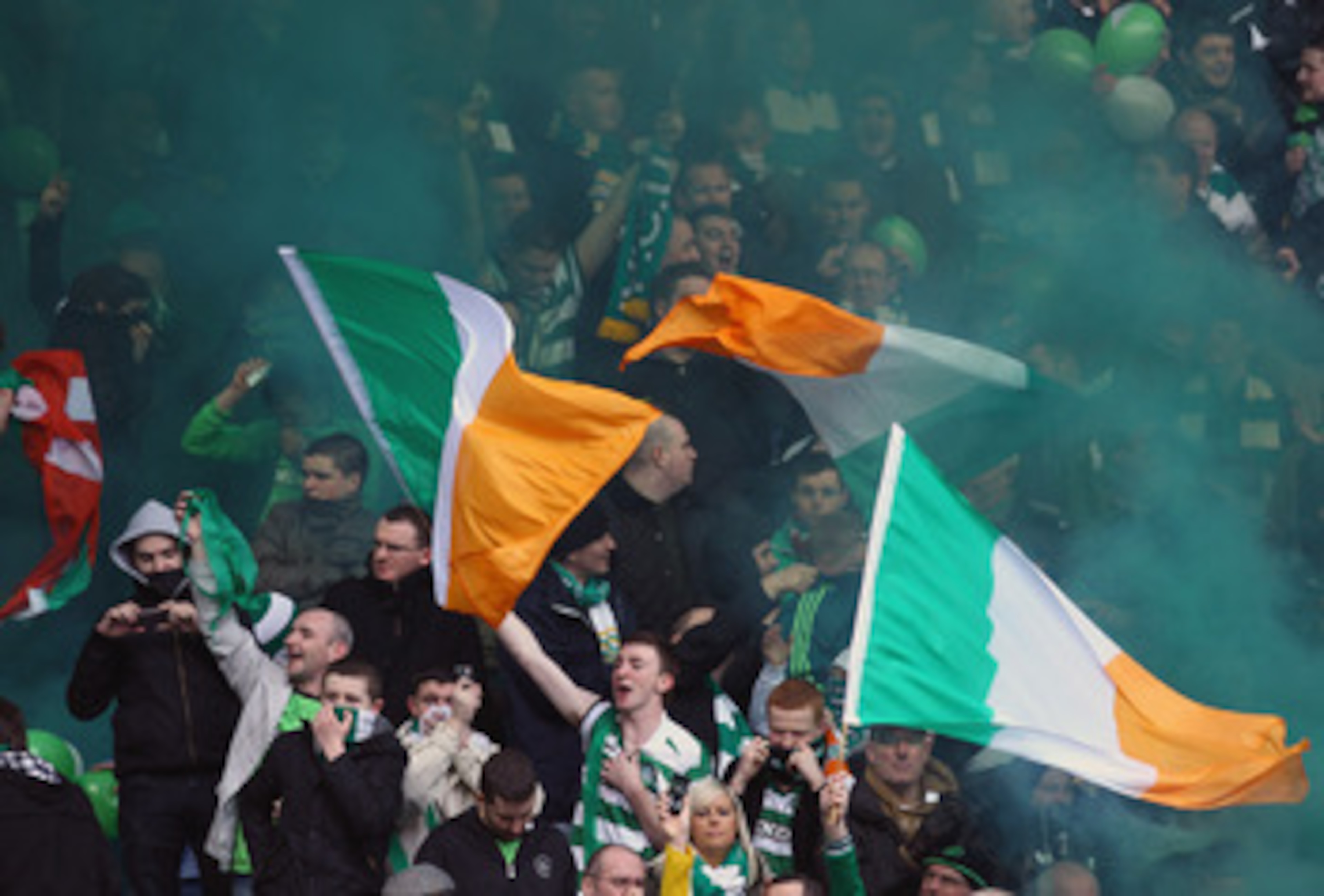 GLASGOW, SCOTLAND - FEBRUARY 06: Celtic fans let off smoke flares during the Scottish Cup 5th round match between Rangers and Celtic at Ibrox Stadium on February 6, 2011 in Glasgow, Scotland..  (Photo by Jeff J Mitchell/Getty Images)