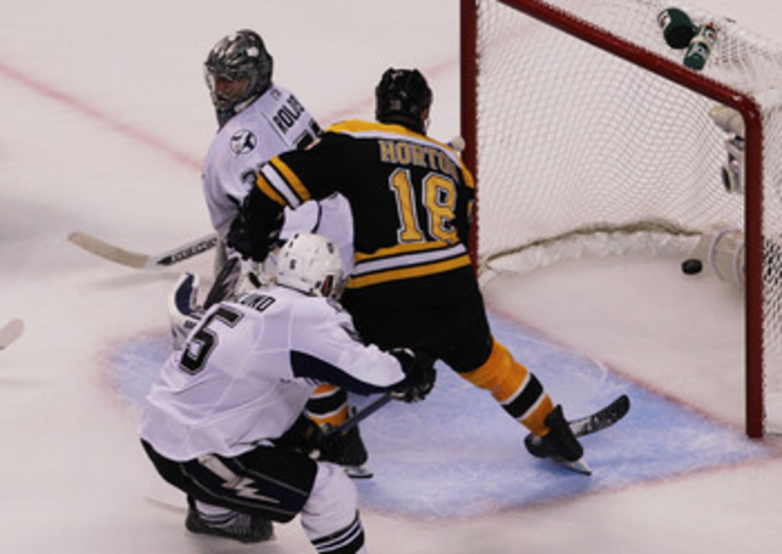 BOSTON, MA - MAY 27:  Nathan Horton #18 of the Boston Bruins scores a third period goal past Dwayne Roloson #35 of the Tampa Bay Lightning in Game Seven of the Eastern Conference Finals during the 2011 NHL Stanley Cup Playoffs at TD Garden on May 27, 2011