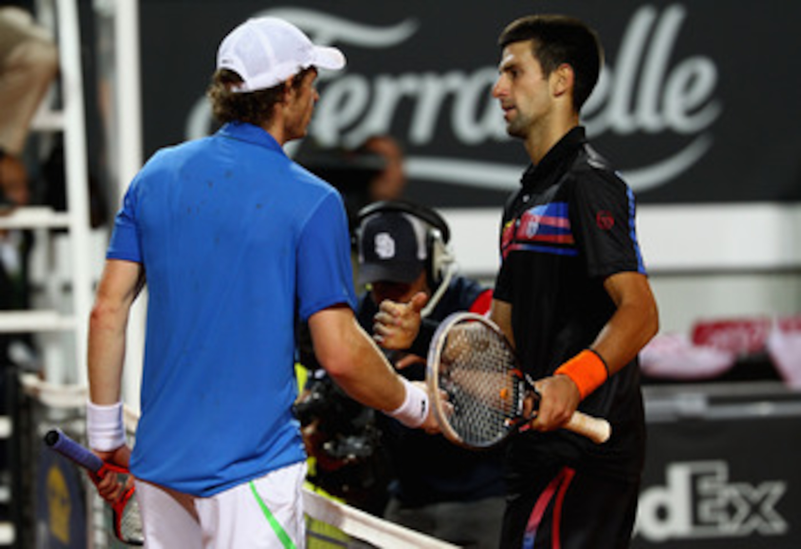 ROME, ITALY - MAY 14:  Novak Djokovic of Serbia shakes hands at the net after his victory in his semi final match against Andy Murray of Great Britain during day seven of the Internazoinali BNL D'Italia at the Foro Italico Tennis Centre  on May 14, 2011 i
