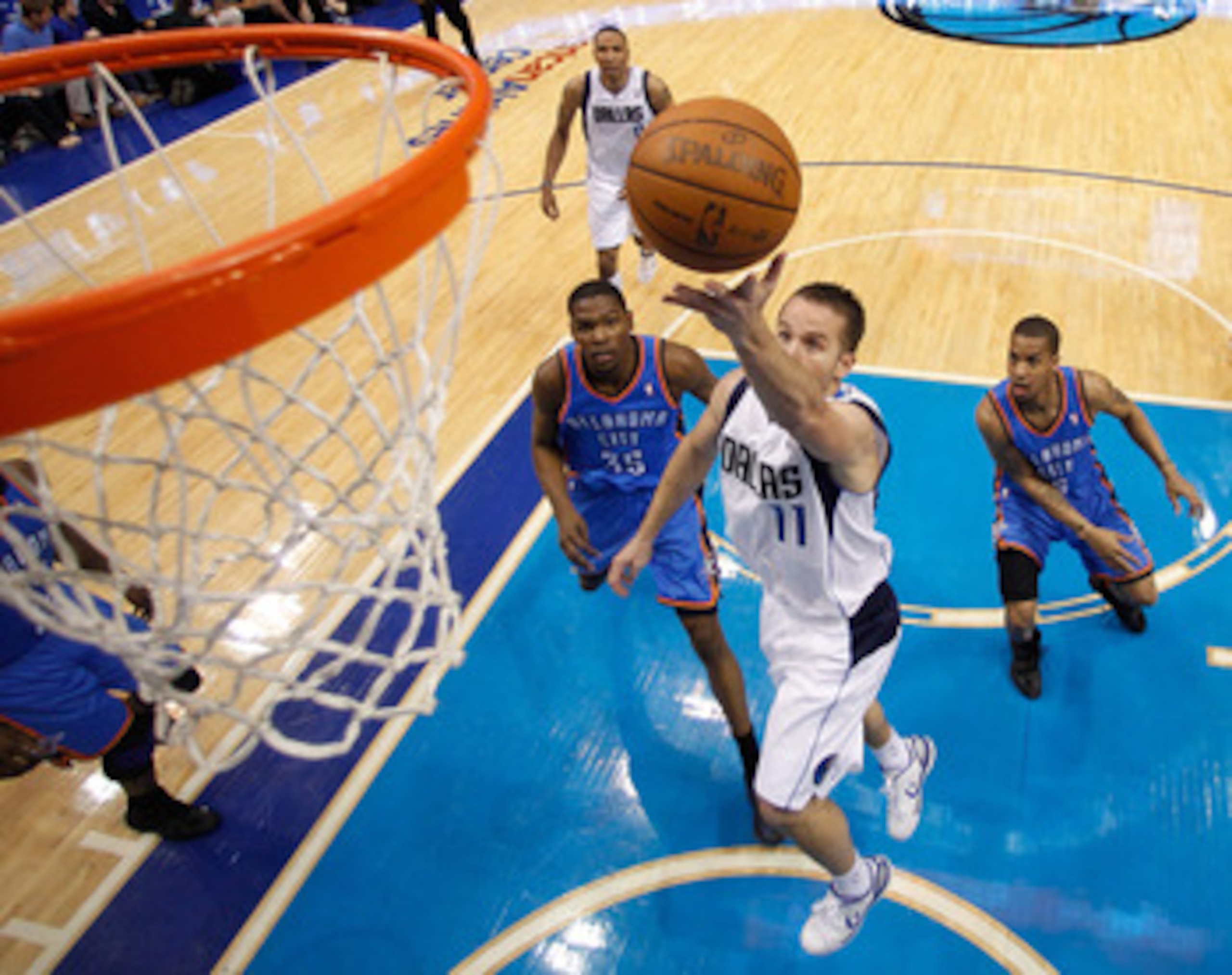 DALLAS, TX - MAY 25:  Jose Juan Barea #11 of the Dallas Mavericks goes up for a shot in front of Eric Maynor #6 of the Oklahoma City Thunder in Game Five of the Western Conference Finals during the 2011 NBA Playoffs at American Airlines Center on May 25, 