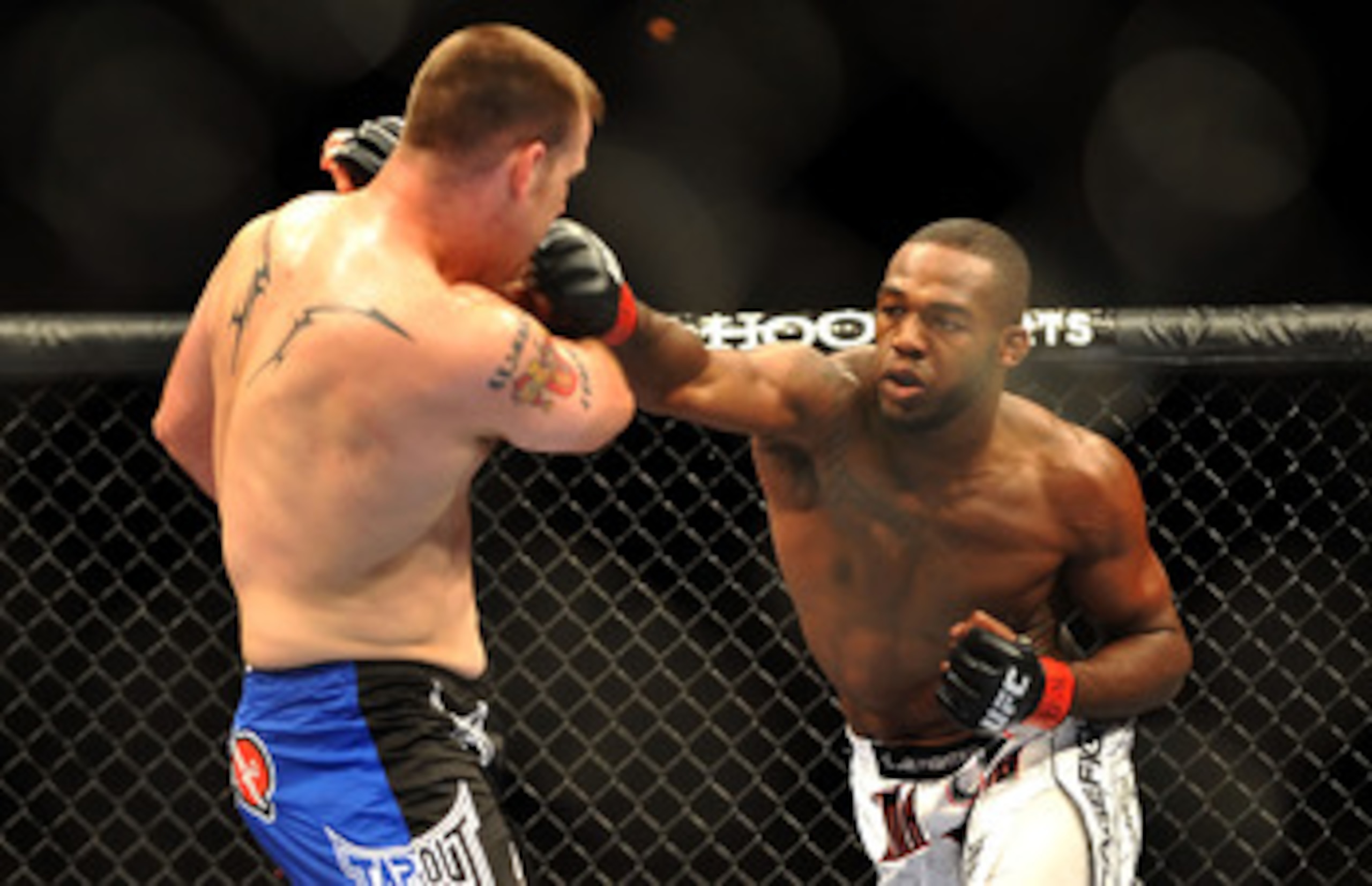 LAS VEGAS - JULY 11:  (R-L) Jon Jones connects with a right punch on Jake O'Brein during their light heavyweight bout during UFC 100 on July 11, 2009 in Las Vegas, Nevada. Jones defeated O'Brein by second round tapout.  (Photo by Jon Kopaloff/Getty Images