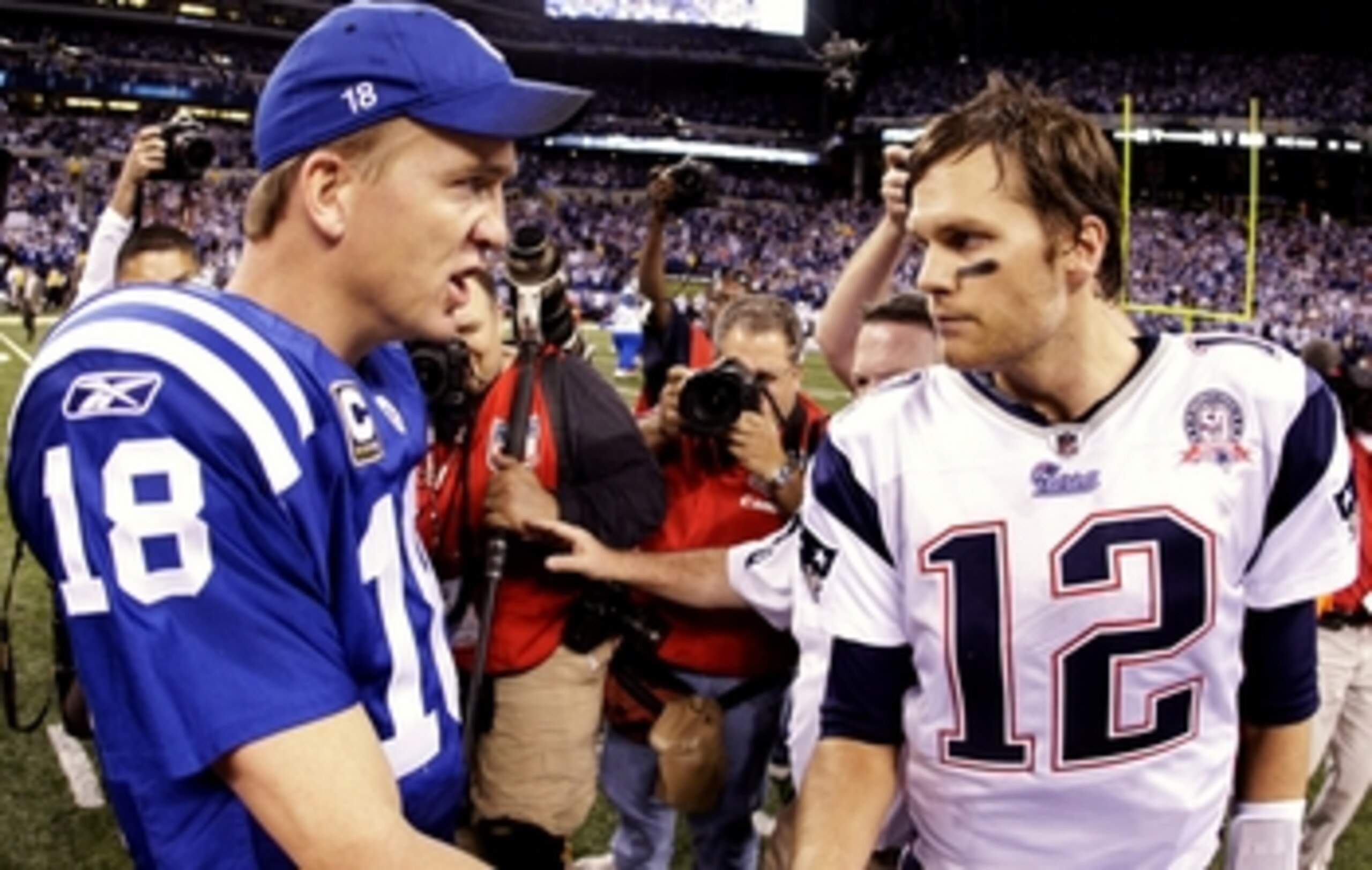 INDIANAPOLIS - NOVEMBER 15:  Quarterback Peyton Manning #18 of the Indianapolis Colts greets Tom Brady #12 of the New England Patriots after the game at Lucas Oil Stadium on November 15, 2009 in Indianapolis, Indiana.  The Colts won the game 35-34.  (Phot