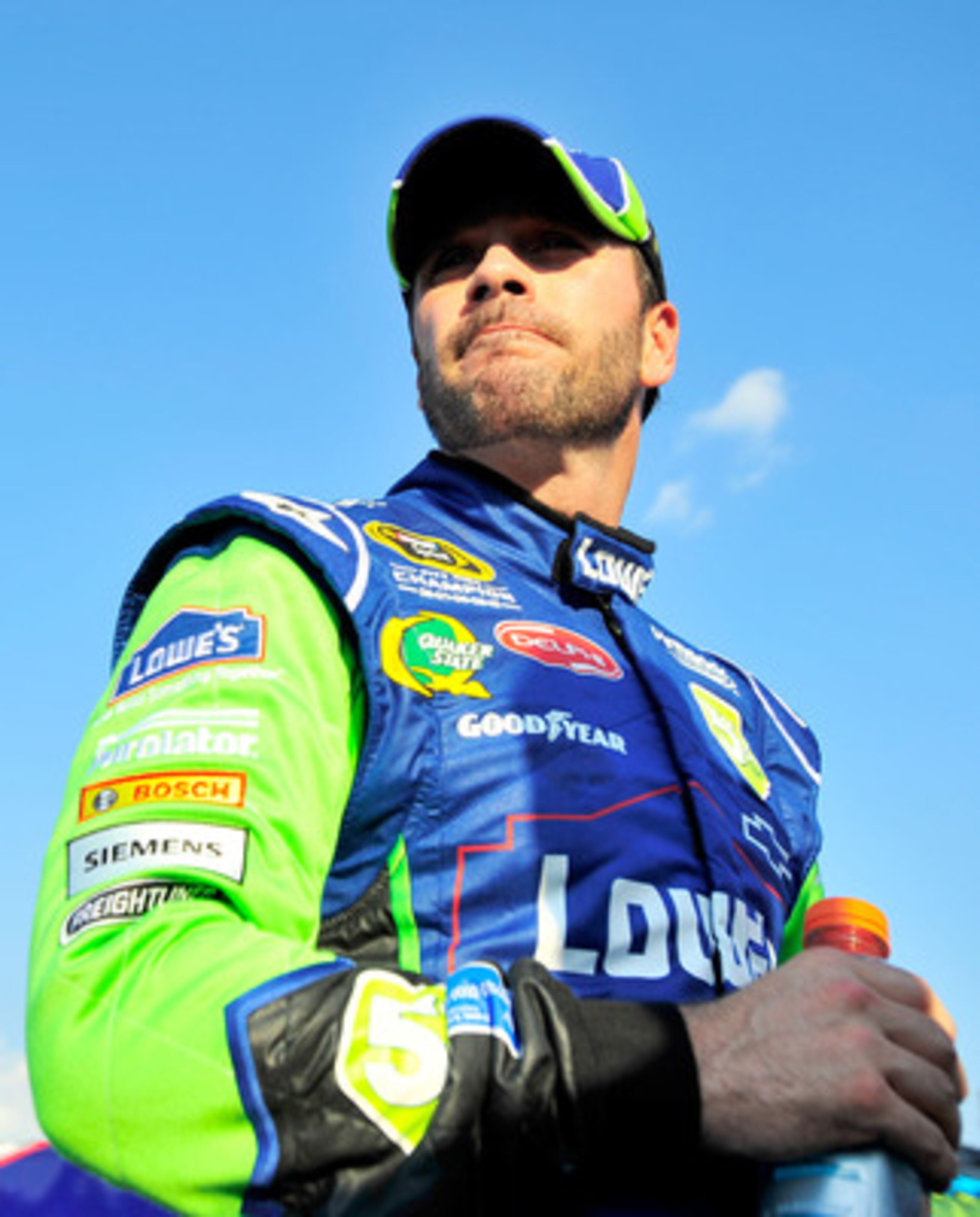 CHARLOTTE, NC - MAY 20:  Jimmie Johnson, driver of the #5 Lowe's 5% Every Day Chevrolet, stands on pit road during qualifying for the NASCAR Sprint All-Star Race at Charlotte Motor Speedway on May 20, 2011 in Charlotte, North Carolina.  (Photo by Jason Sm