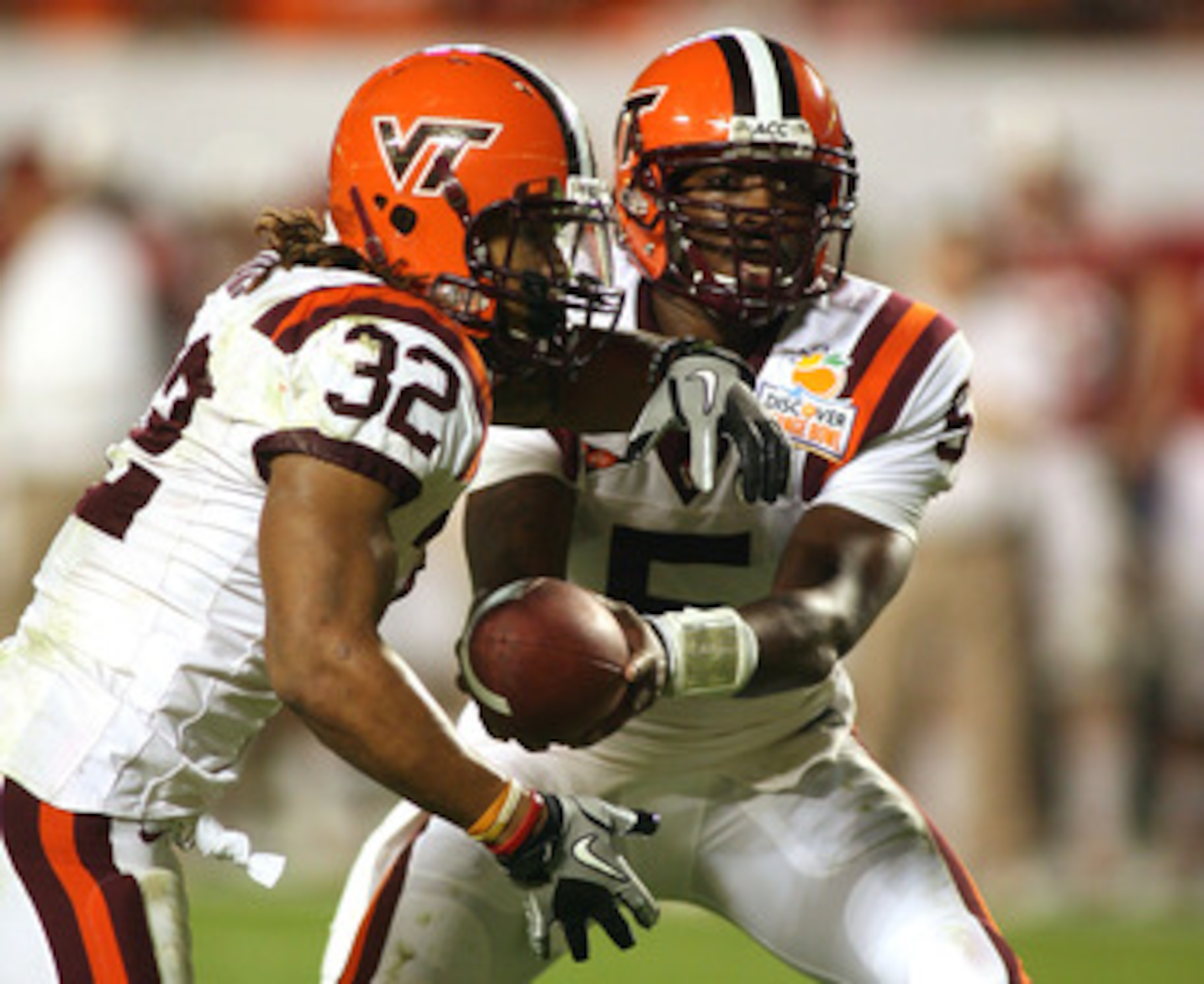 MIAMI, FL - JANUARY 03: Tyrod Taylor #5 of the Virginia Tech Hokies hands the ball off to Darren Evans #32 against the Stanford Cardinal during the 2011 Discover Orange Bowl at Sun Life Stadium on January 3, 2011 in Miami, Florida. Stanford won 40-12. ( MIAMI, FL - JANUARY 03: Tyrod Taylor #5 of the Virginia Tech Hokies hands the ball off to Darren Evans #32 against the Stanford Cardinal during the 2011 Discover Orange Bowl at Sun Life Stadium on January 3, 2011 in Miami, Florida. Stanford won 40-12. (