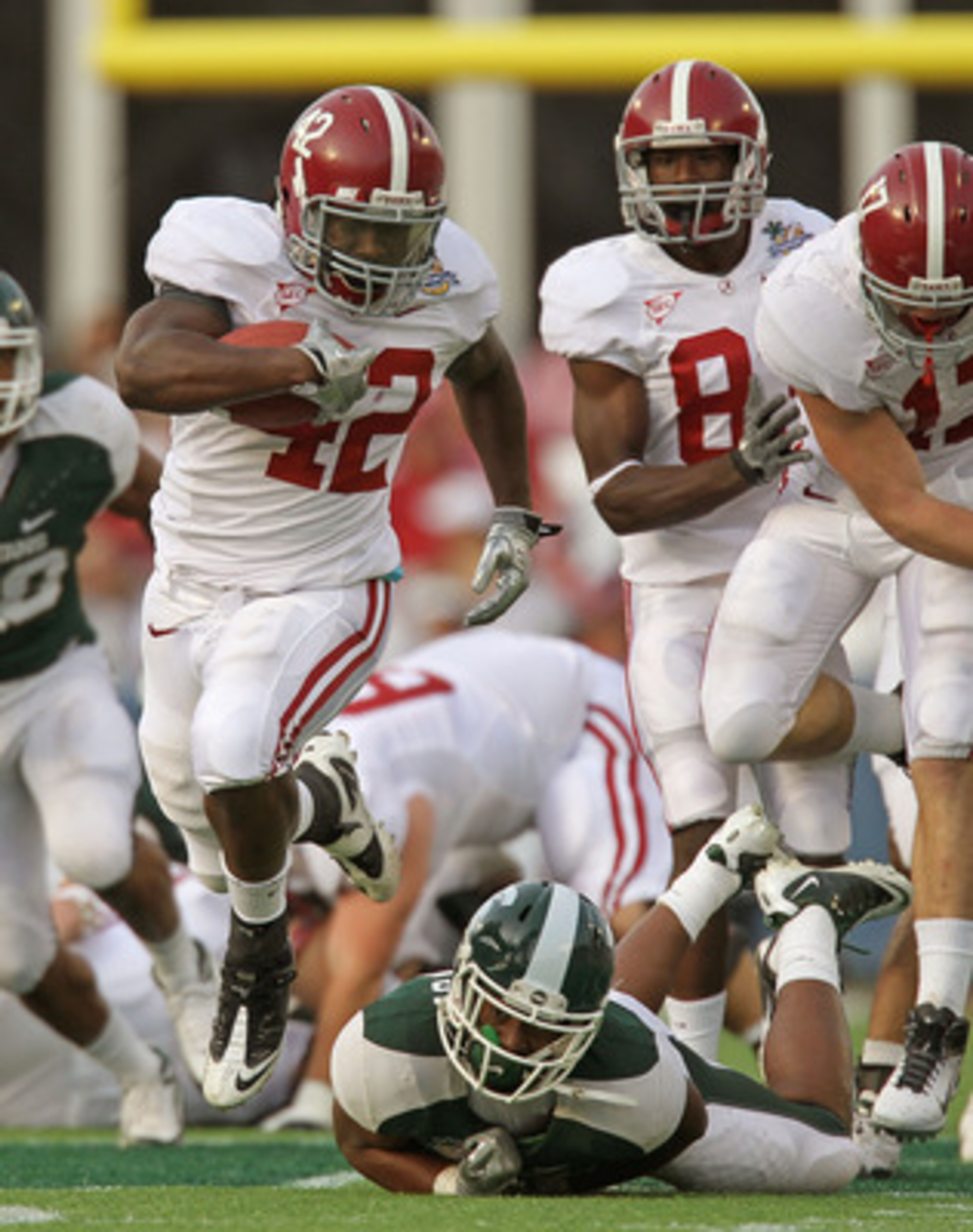 ORLANDO, FL - JANUARY 01: Eddie Lacy #42 of the Alabama Crimson Tide rushes for a touchdown during the Capitol One Bowl against the Michigan State Spartans at the Florida Citrus Bowl on January 1, 2011 in Orlando, Florida. (Photo by Mike Ehrmann/Getty I ORLANDO, FL - JANUARY 01: Eddie Lacy #42 of the Alabama Crimson Tide rushes for a touchdown during the Capitol One Bowl against the Michigan State Spartans at the Florida Citrus Bowl on January 1, 2011 in Orlando, Florida. (Photo by Mike Ehrmann/Getty I
