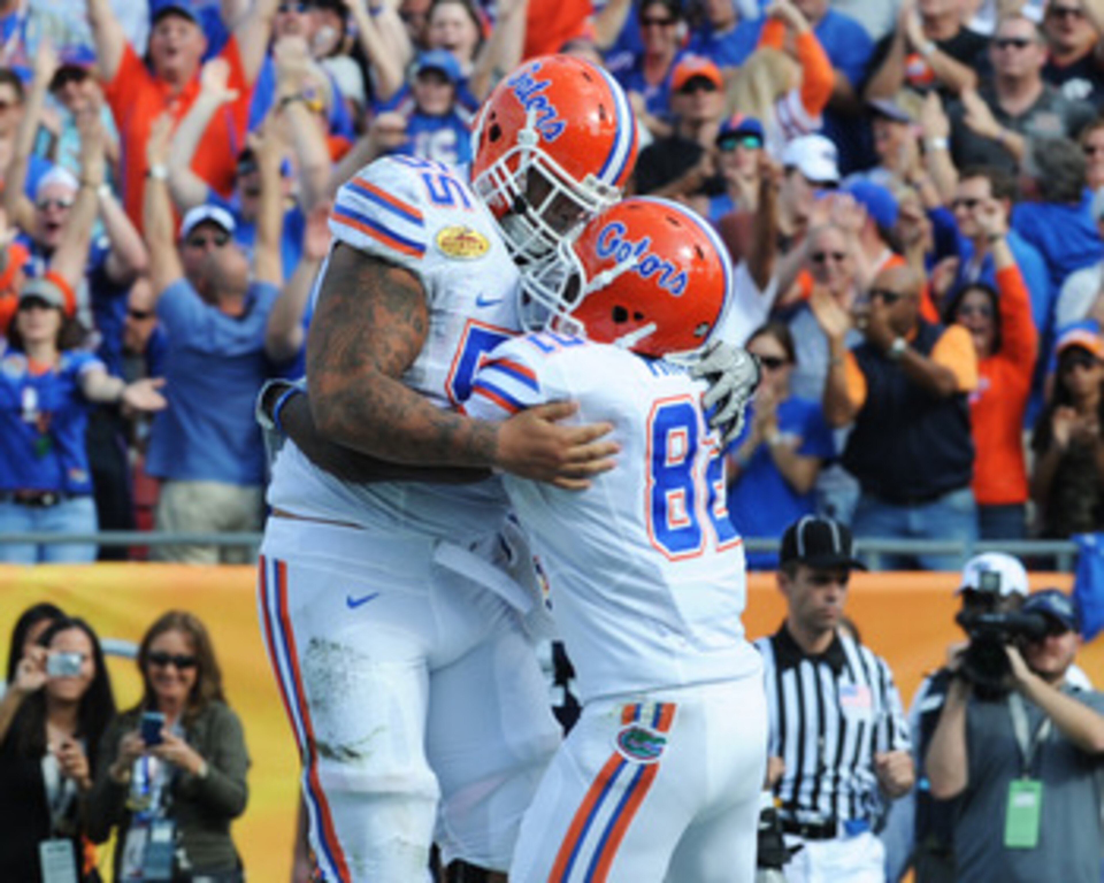TAMPA, FL - JANUARY 1: Wide receiver Omarius Hines #82 of the Florida Gators celebrates a touchdown catch with center Mike Pouncey #55 against the Penn State Nittany Lions January 1, 2010 in the 25th Outback Bowl at Raymond James Stadium in Tampa, Florid TAMPA, FL - JANUARY 1: Wide receiver Omarius Hines #82 of the Florida Gators celebrates a touchdown catch with center Mike Pouncey #55 against the Penn State Nittany Lions January 1, 2010 in the 25th Outback Bowl at Raymond James Stadium in Tampa, Florid