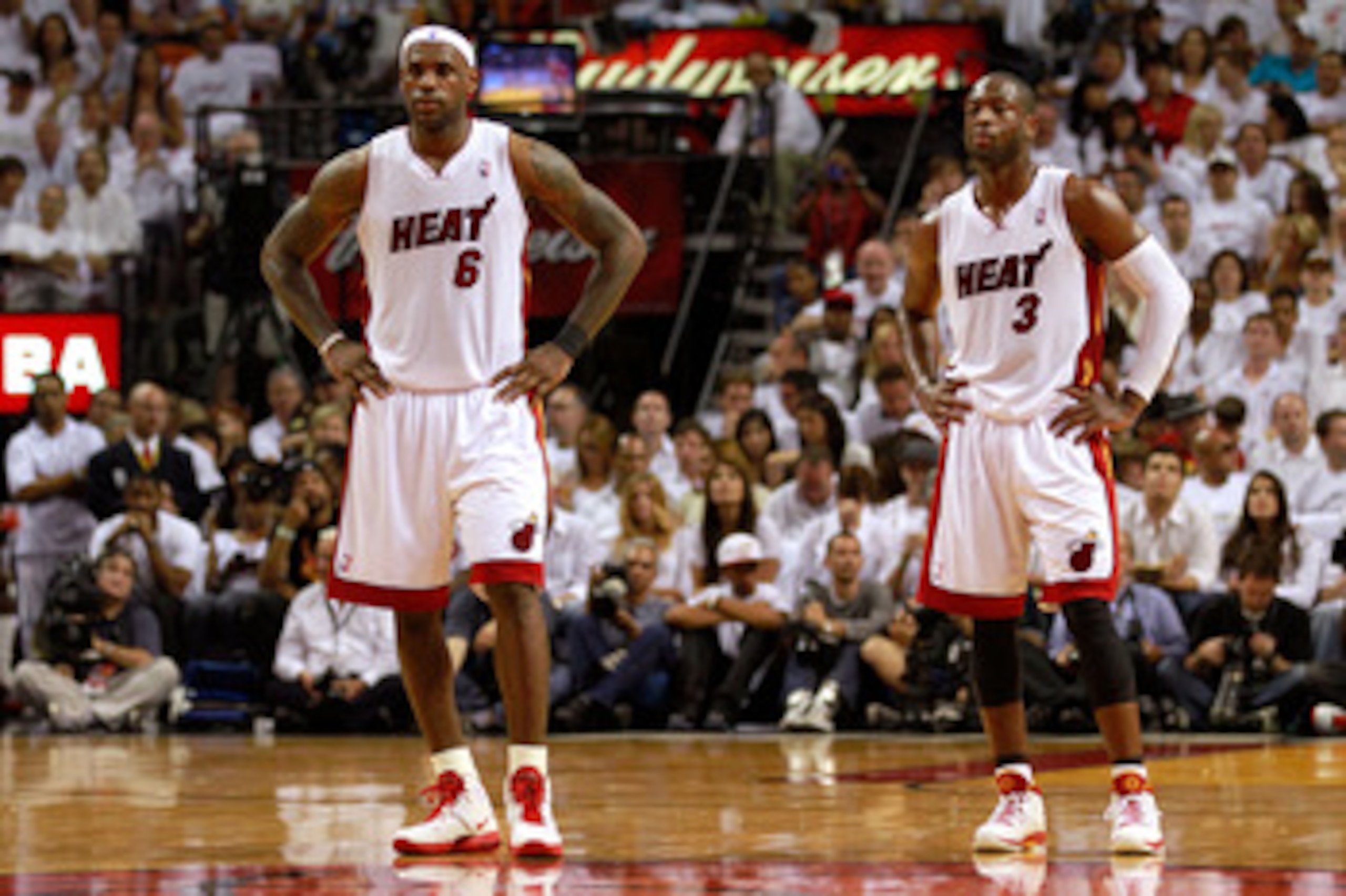 MIAMI, FL - MAY 22: (L-R) LeBron James #6 and Dwyane Wade #3 of the Miami Heat look on against the Chicago Bulls in Game Three of the Eastern Conference Finals during the 2011 NBA Playoffs on May 22, 2011 at American Airlines Arena in Miami, Florida. NO MIAMI, FL - MAY 22: (L-R) LeBron James #6 and Dwyane Wade #3 of the Miami Heat look on against the Chicago Bulls in Game Three of the Eastern Conference Finals during the 2011 NBA Playoffs on May 22, 2011 at American Airlines Arena in Miami, Florida. NO