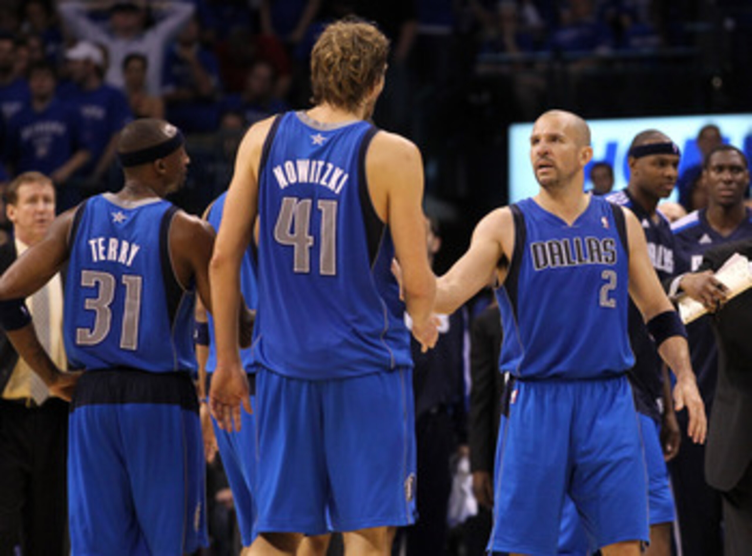 OKLAHOMA CITY, OK - MAY 23:  (R-L) Jason Kidd #2, Dirk Nowitzki #41 and Jason Terry #31 of the Dallas Mavericks celebrates in overtime against the Oklahoma City Thunder in Game Four of the Western Conference Finals during the 2011 NBA Playoffs at Oklahoma