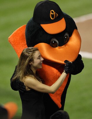 BALTIMORE, MD - MAY 25: The Baltimore Orioles mascot dances with a fan during the Baltimore Orioles and Kansas City Royals game at Oriole Park at Camden Yards on May 25, 2011 in Baltimore, Maryland.  (Photo by Rob Carr/Getty Images)