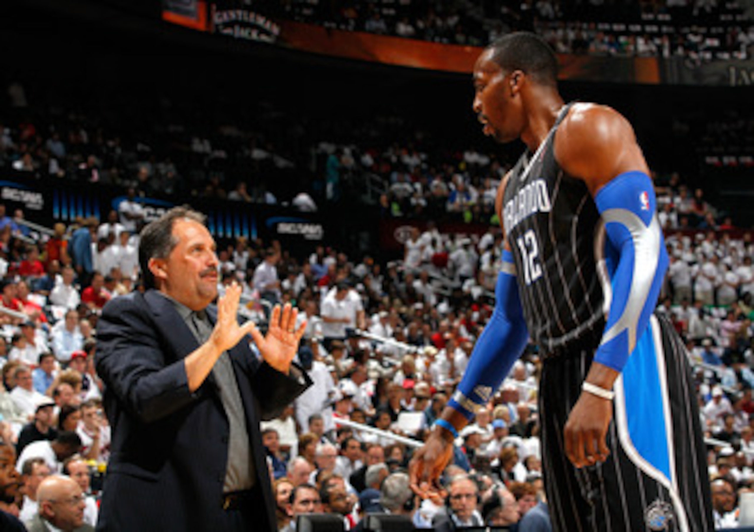 ATLANTA, GA - APRIL 28:  Head coach Stan Van Gundy converses with Dwight Howard #12 of the Orlando Magic during Game Six of the Eastern Conference Quarterfinals in the 2011 NBA Playoffs against the Atlanta Hawks at Philips Arena on April 28, 2011 in Atlan