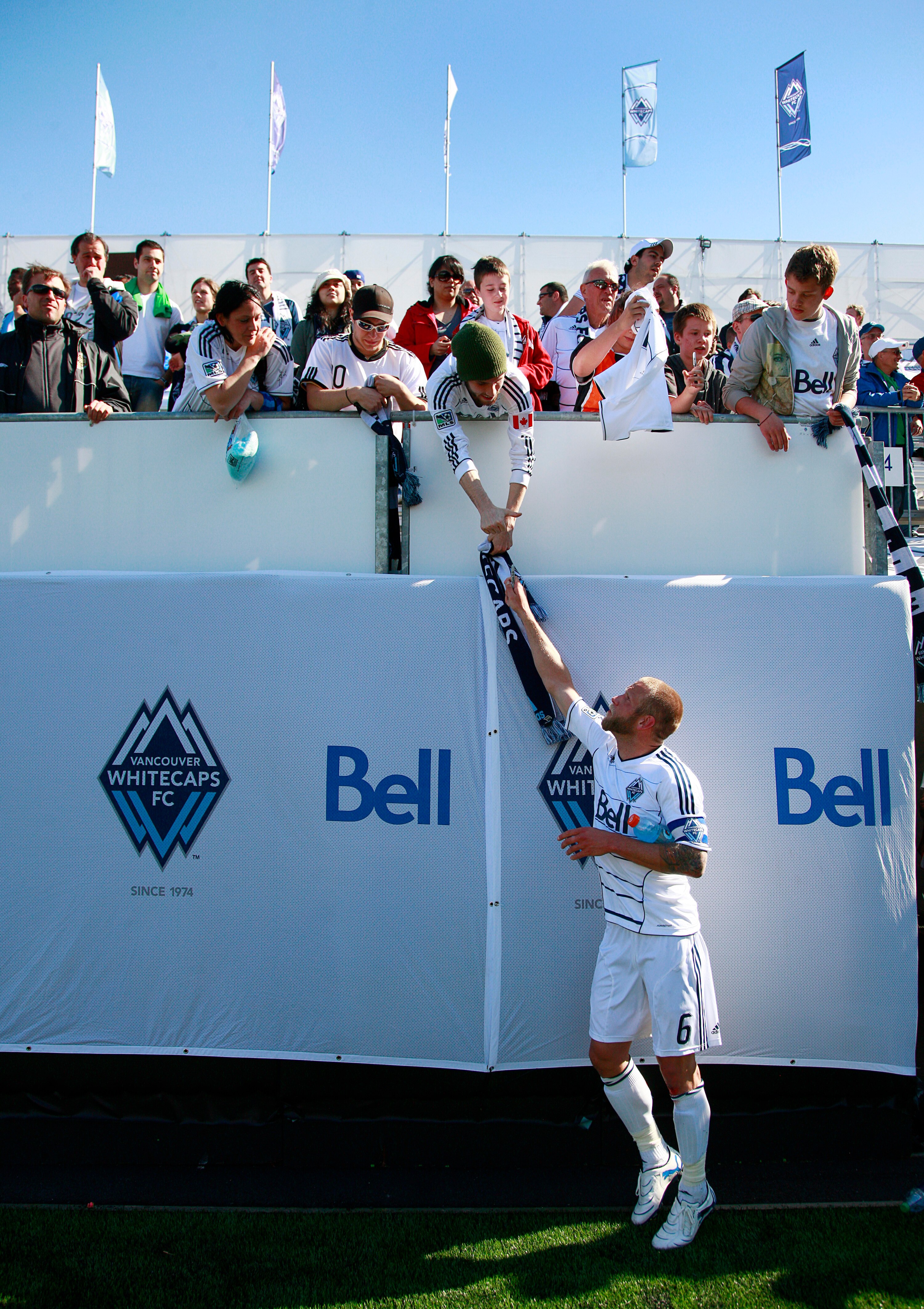 VANCOUVER, CANADA - MAY 28:  Jay DeMerit #6 of the Vancouver Whitecaps FC signs autographs after their MLS match against the New York Red Bulls May 28, 2011 in Vancouver, British Columbia, Canada.  Vancouver and New York tied 1-1. (Photo by Jeff Vinnick/G