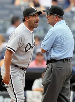NEW YORK - MAY 02:  Manager Ozzie Guillen of the Chicago White Sox gets in a few last words with first base umpire Dale Scott after being ejected from the game against the New York Yankees by home plate umpire Dan Iassogna (not pictured) on May 2, 2010 at