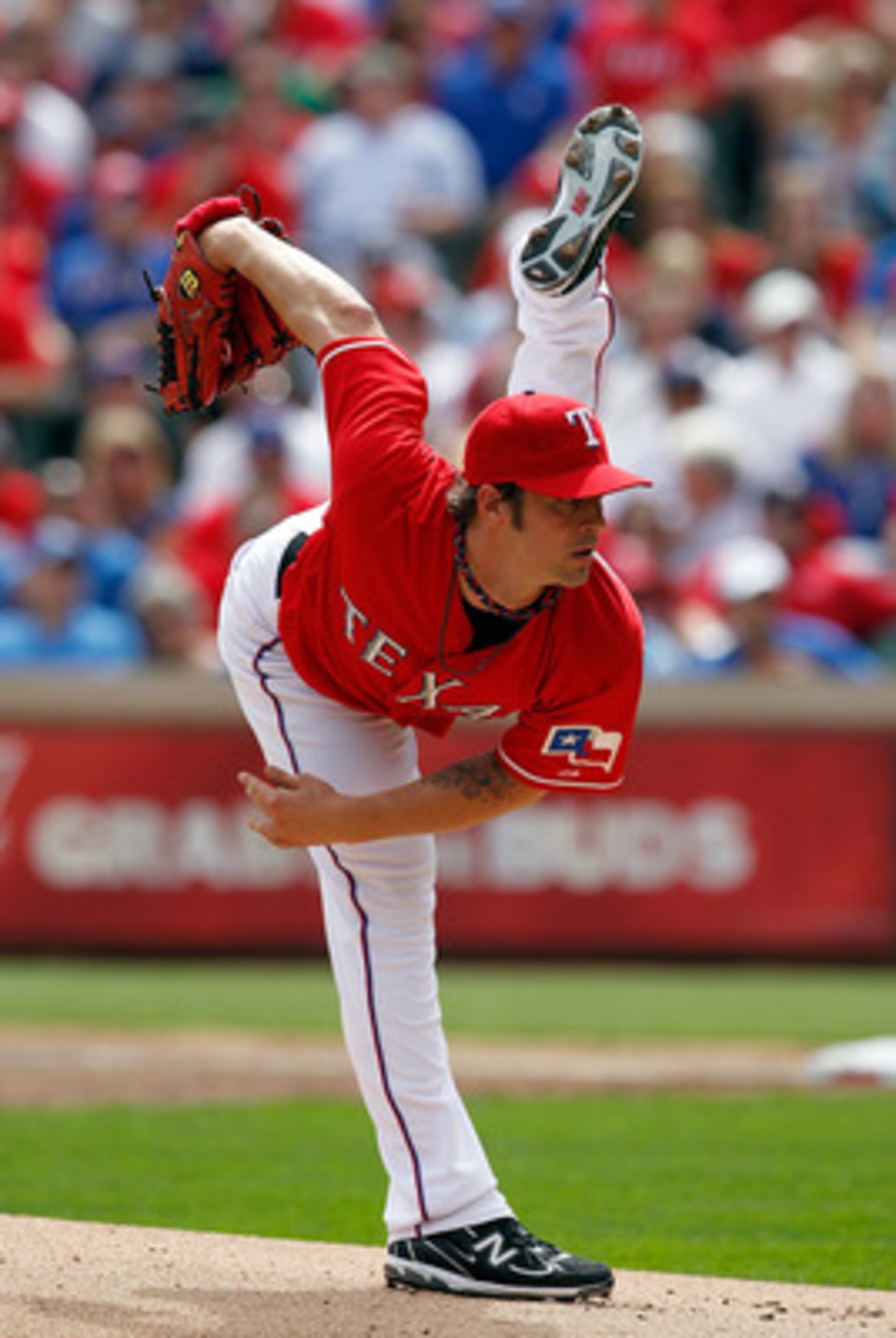 ARLINGTON, TX - APRIL 01:  Starting pitcher C.J. Wilson, #36 of the Texas Rangers, throws against the Boston Red Sox on Opening Day at Rangers Ballpark in Arlington on April 1, 2011 in Arlington, Texas.  (Photo by Tom Pennington/Getty Images)
