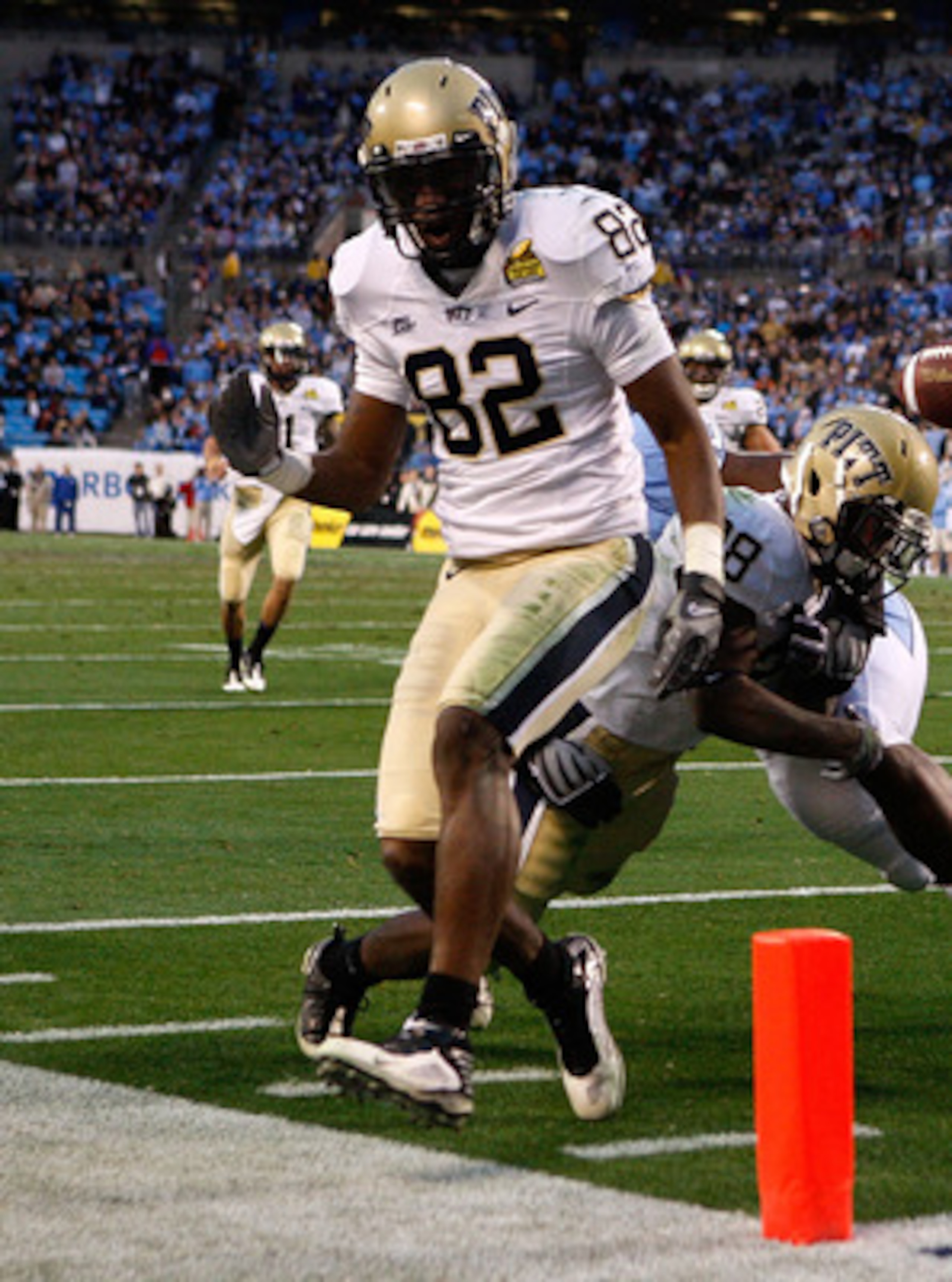 CHARLOTTE, NC - DECEMBER 26:  Jonathan Baldwin #82 of the Pittsburgh Panthers watches as teammate Dion Lewis #28 fumbles the ball at the goal line against the North Carolina Tar Heels during their game on December 26, 2009 in Charlotte, North Carolina.  (