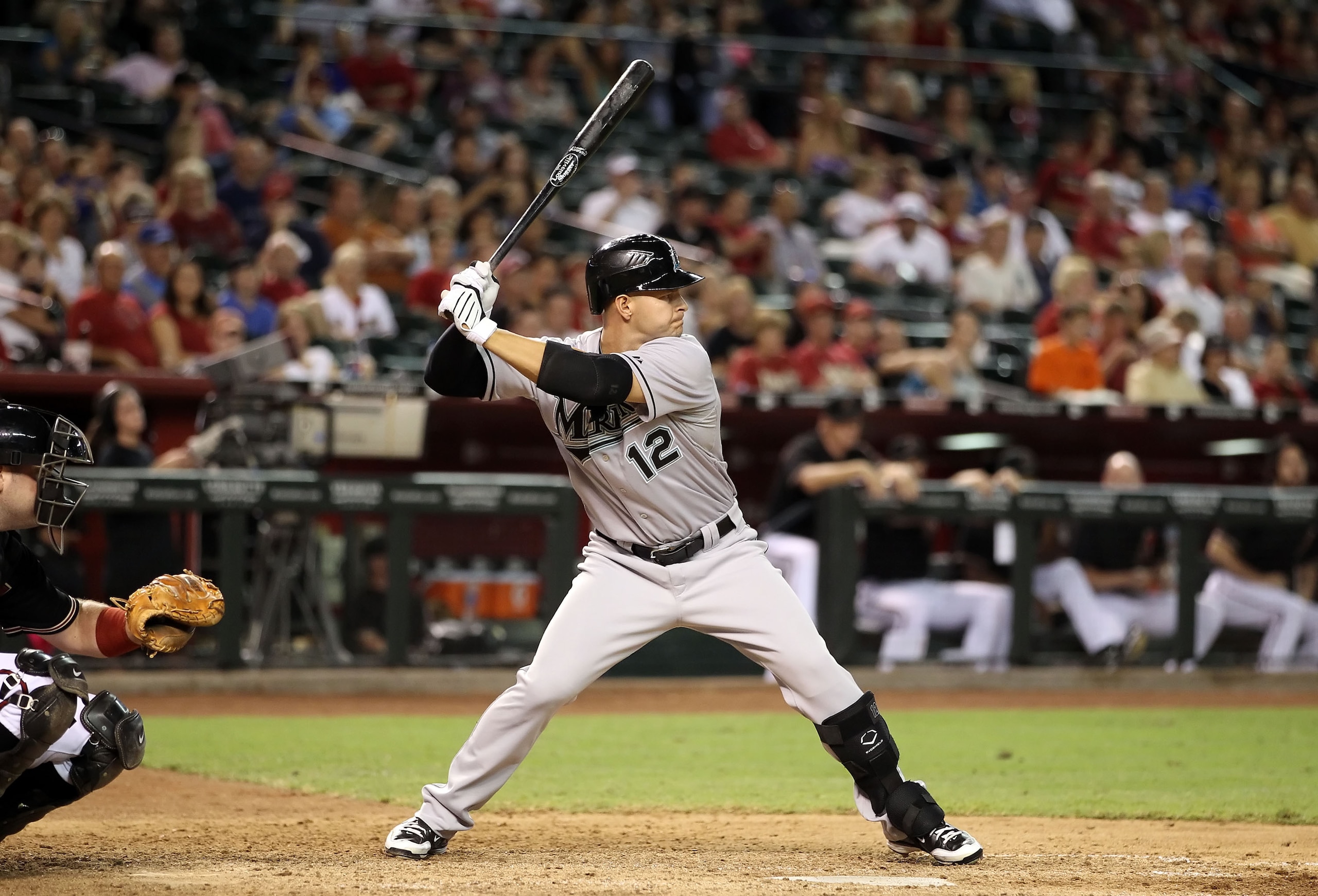 PHOENIX - JULY 10:  Cody Ross #12 of the Florida Marlins bats against the Arizona Diamondbacks during the Major League Baseball game at Chase Field on July 10, 2010 in Phoenix, Arizona.  (Photo by Christian Petersen/Getty Images)