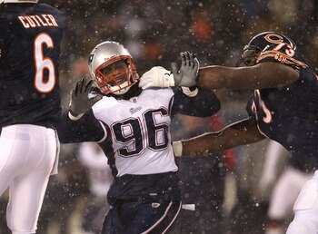 CHICAGO, IL - DECEMBER 12: Jermaine Cunningham #96 of the New England Patriots rushes past J'Marcus Webb #73 of the Chicago Bears towards Jay Cutler #6 at Soldier Field on December 12, 2010 in Chicago, Illinois. The Patriots defeated the Bears 36-7. (Phot